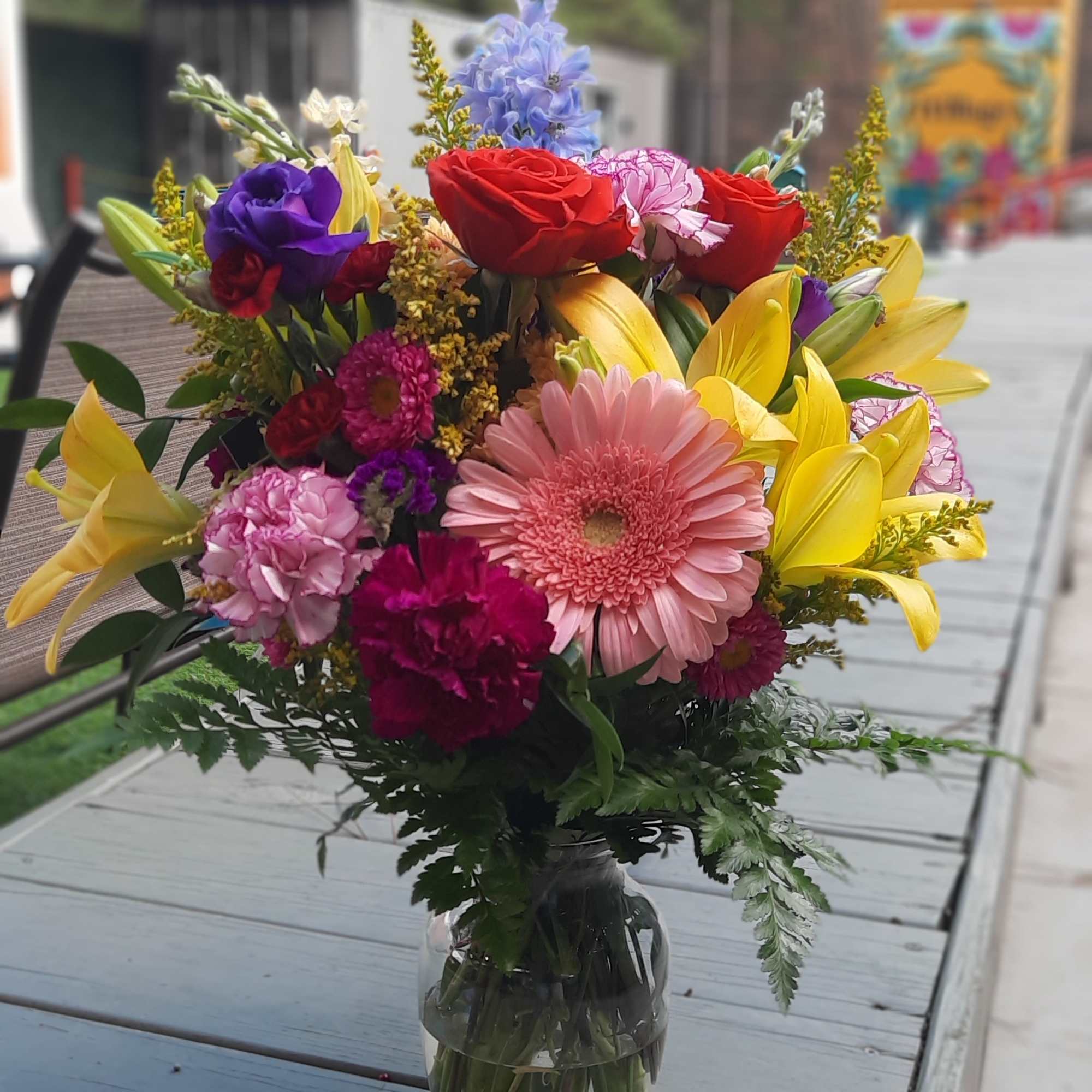 Colorful mixed bouquet in a clear glass vase