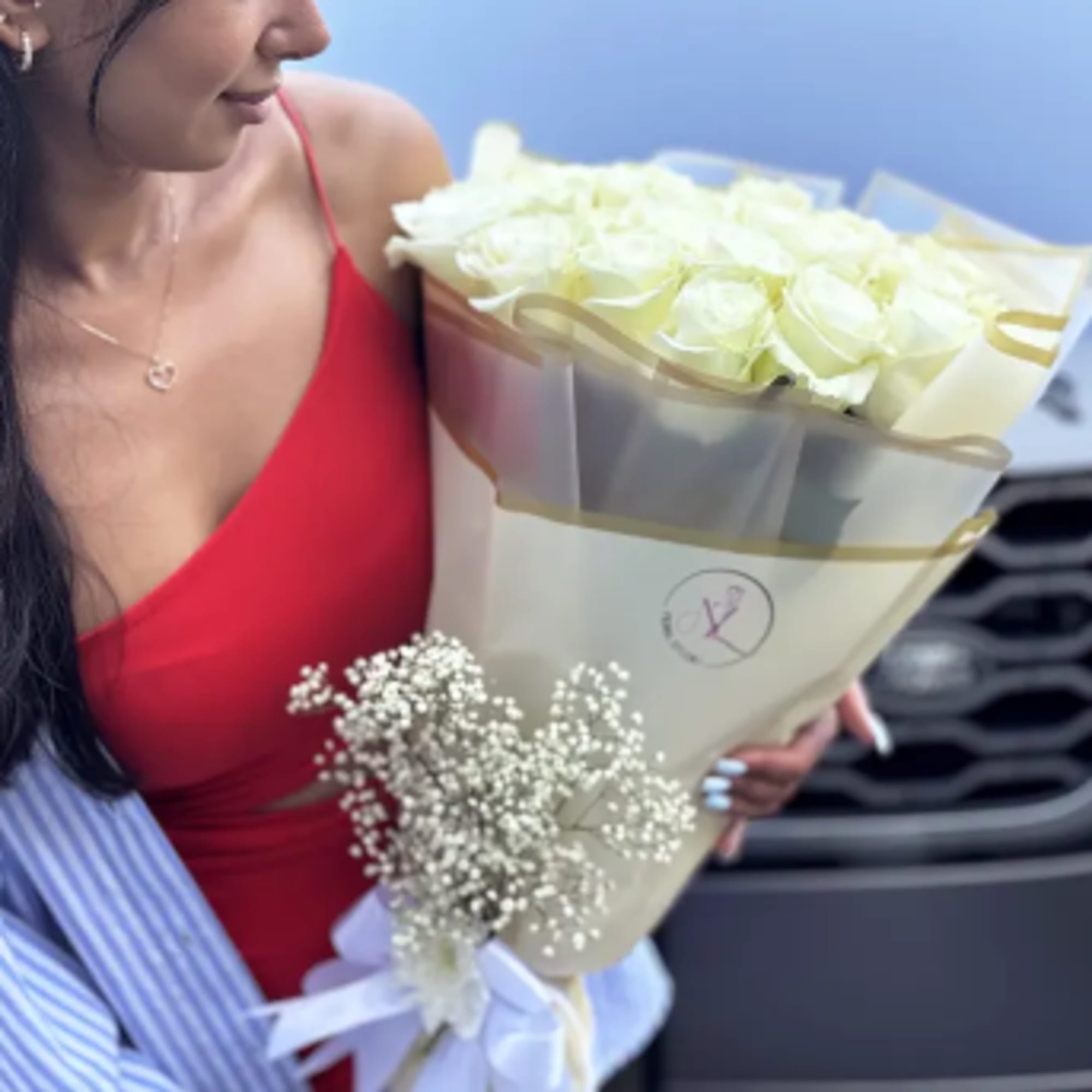 A luxurious bouquet of fresh, premium white roses, carefully selected for their
