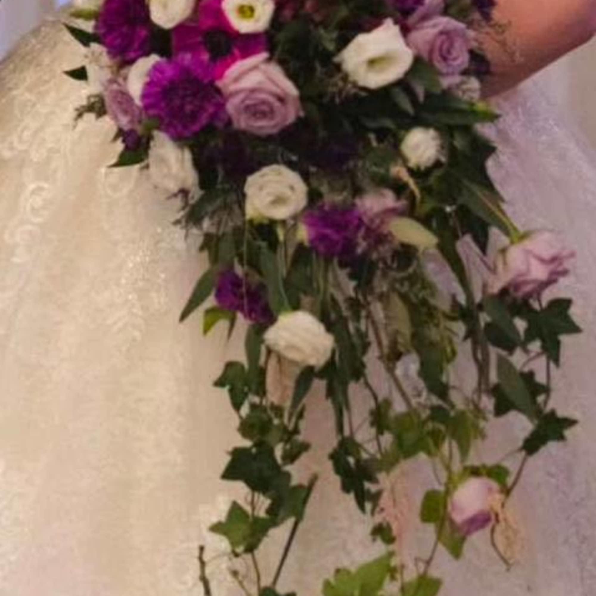 This cascading bridal bouquet is a statement piece designed for elegant weddings