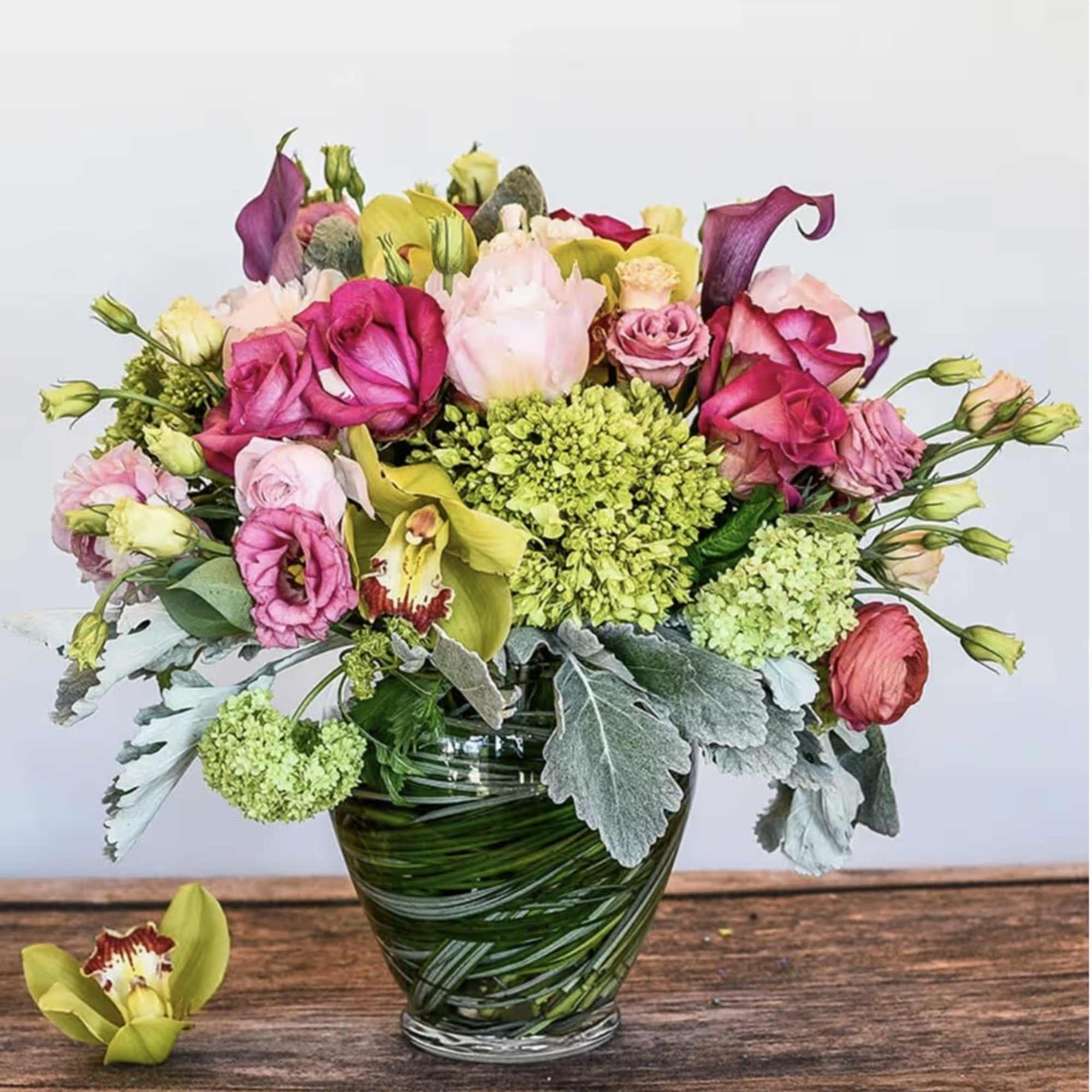 Feminine display of pastels, soft and elegant in a mid height vase.