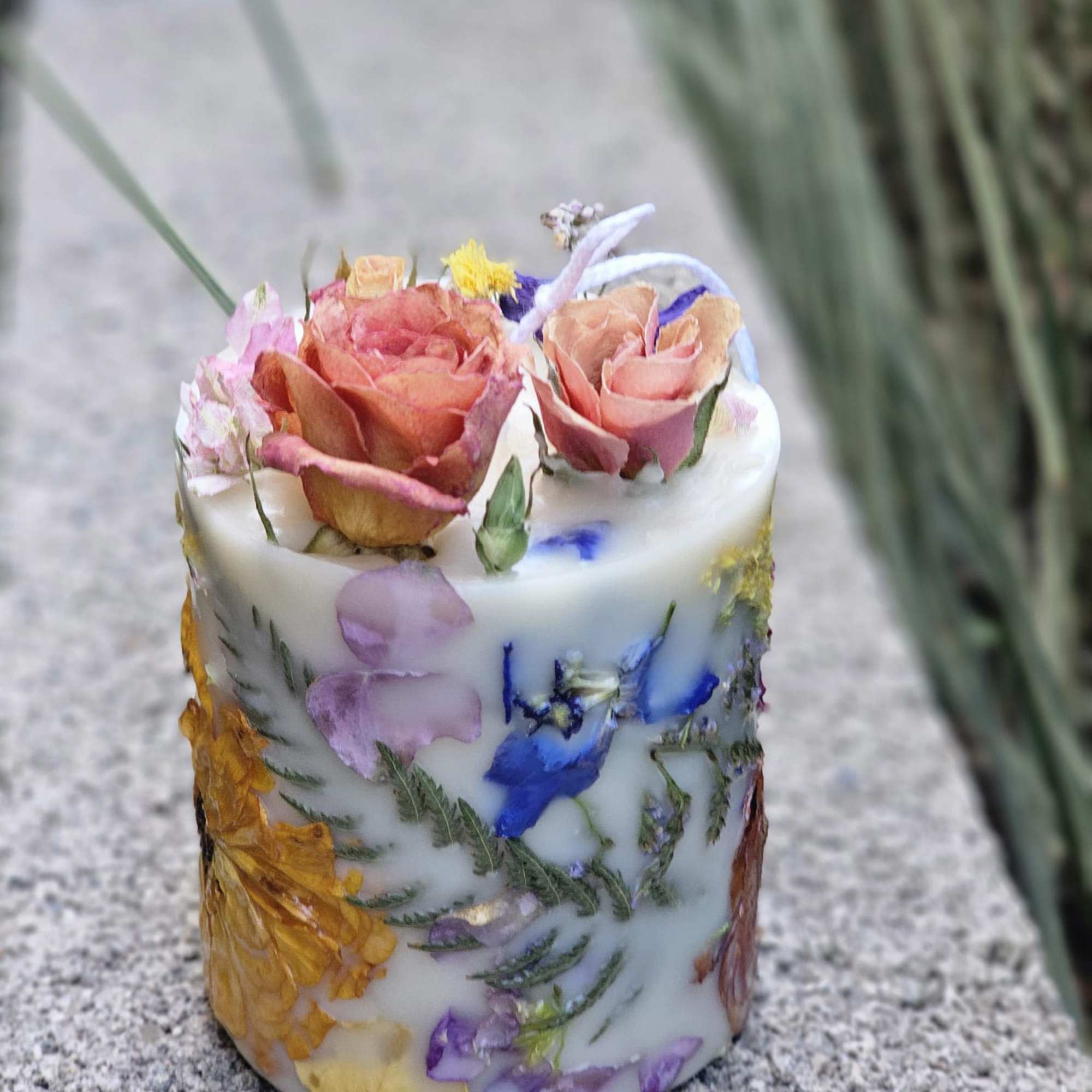 A romantic heart-shaped box filled with pastel roses and seasonal blooms, paired