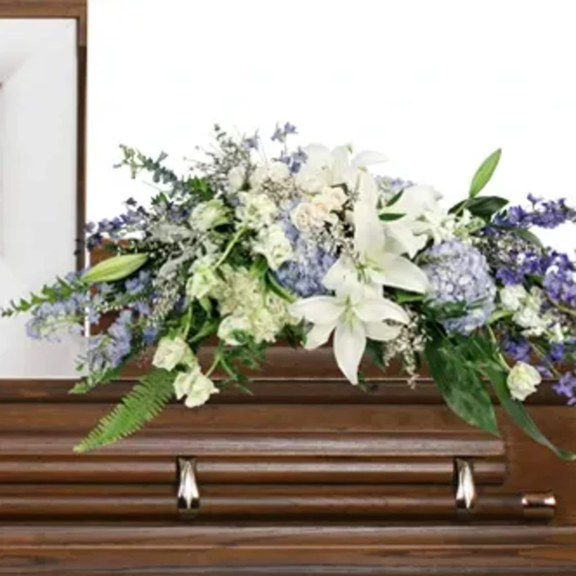 Lay them to rest under a blanket of blue and white flowers.