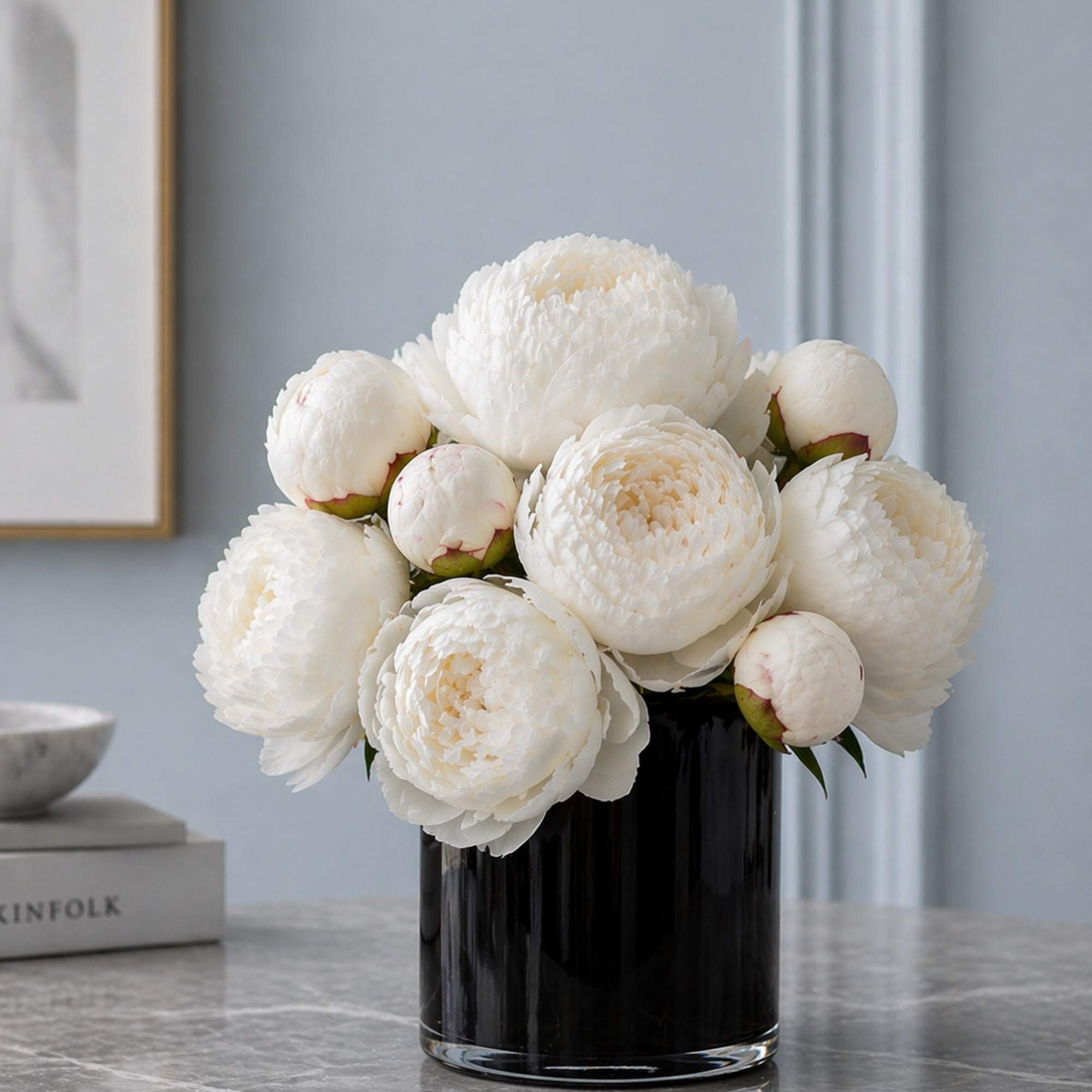 Lush + Luxe white peony artfully arrangement in a contrasting black glass