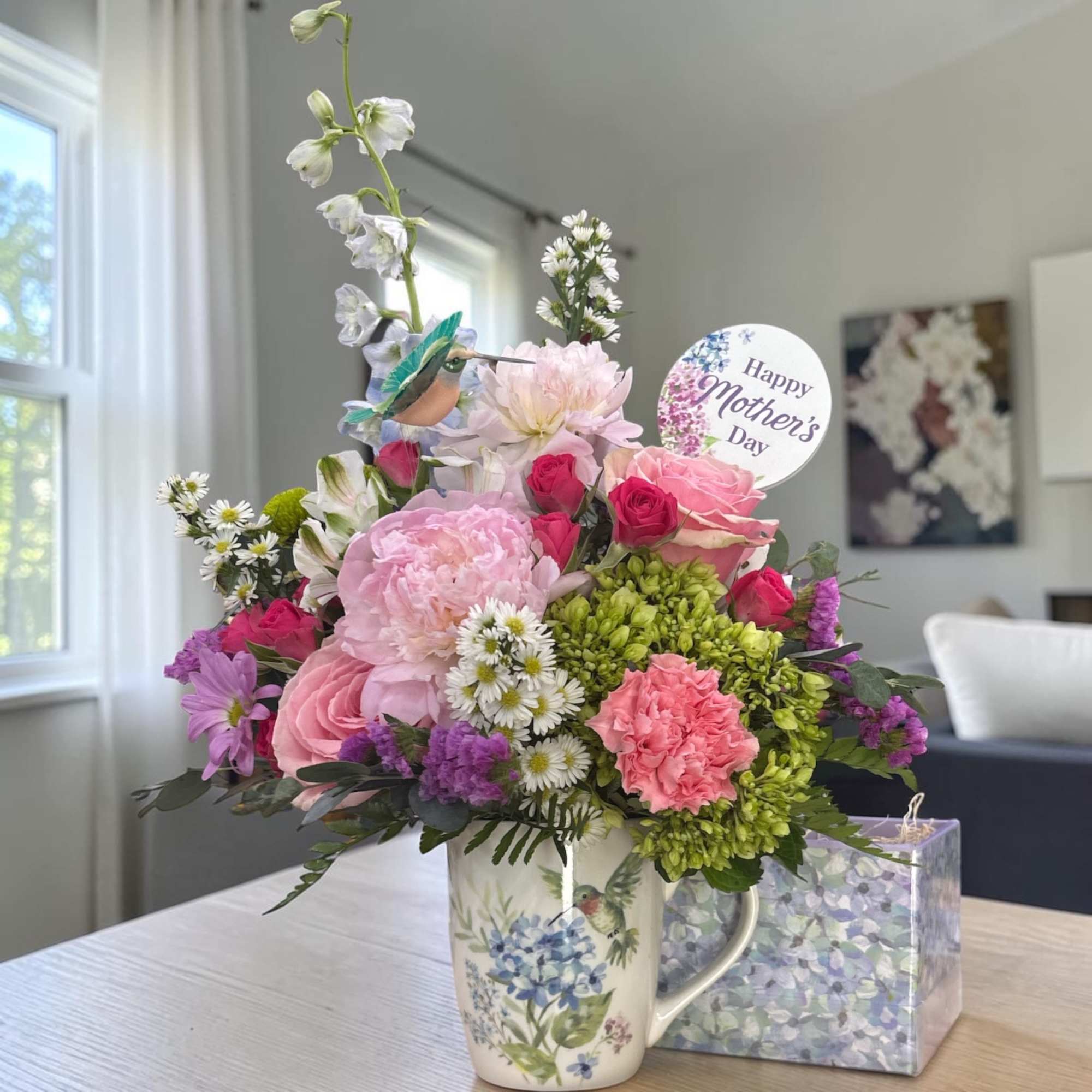 Celebrate Mom with our charming Fluttering Garden Coffee Mug, a fresh flower