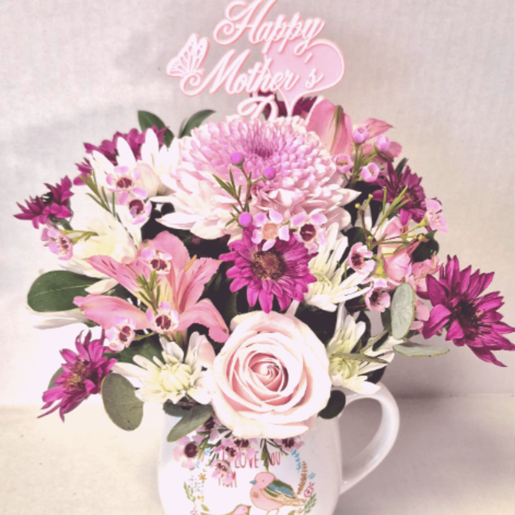 A lovely sentiment in a beautiful mug filled with flowers. Add a