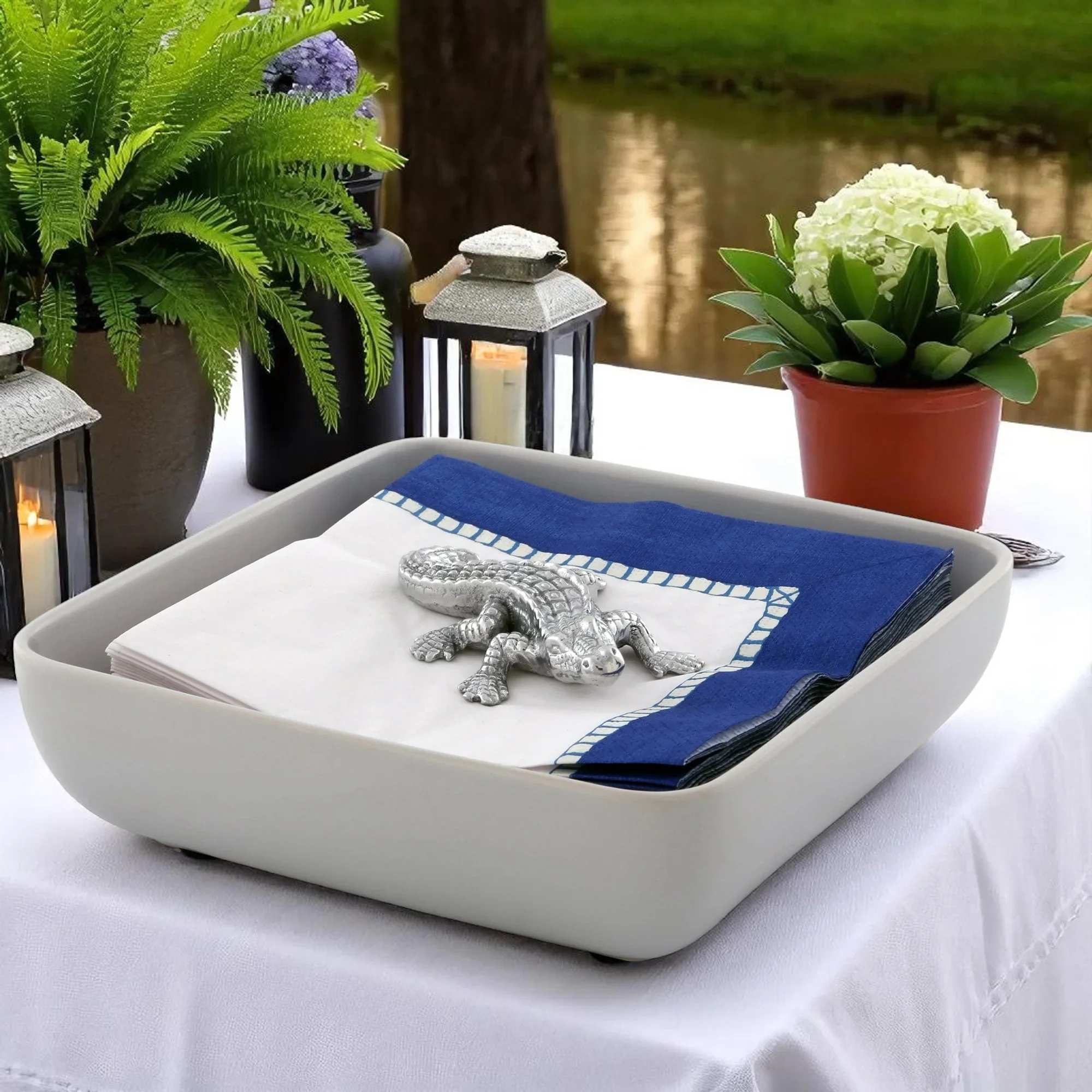 A 3 inch gleaming silver alligator napkin weight makes a playful, polished