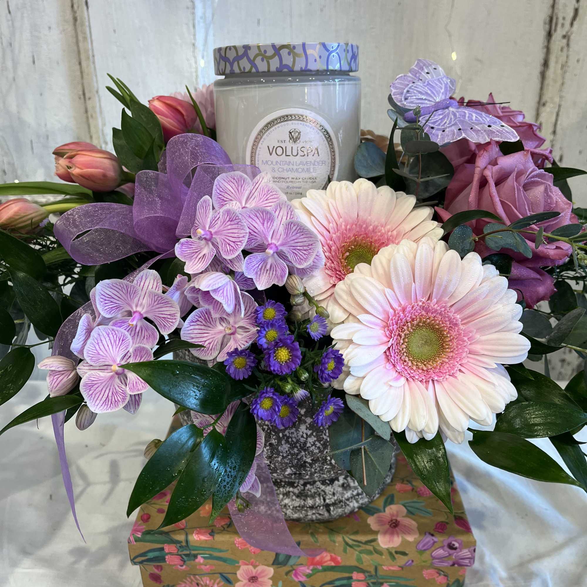 Stone Compote featuring an 18 ounce Mountain Lavender &amp; Chamomile Voluspa candle.