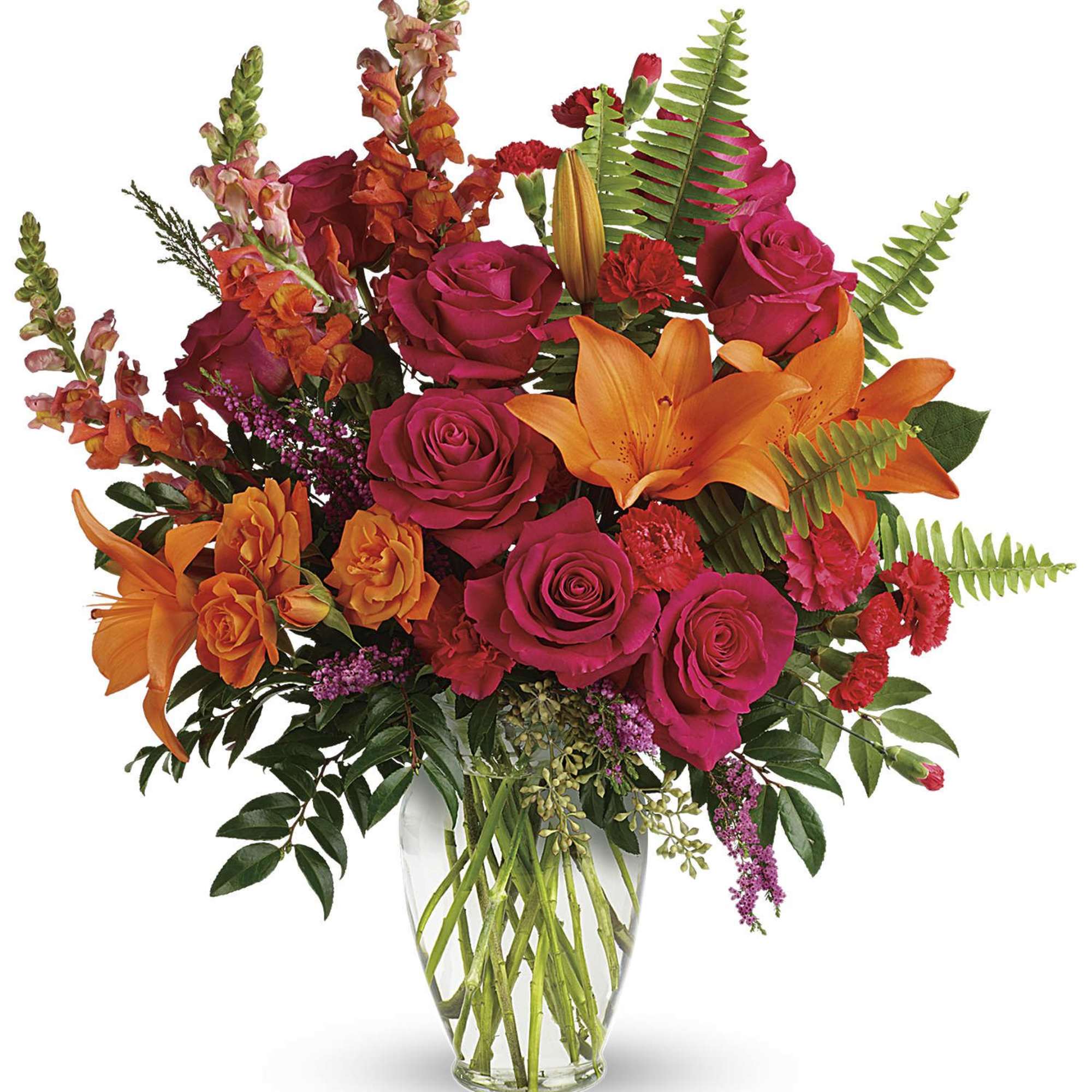 Bright bouquet of pink roses and orange lilies in a clear glass vase