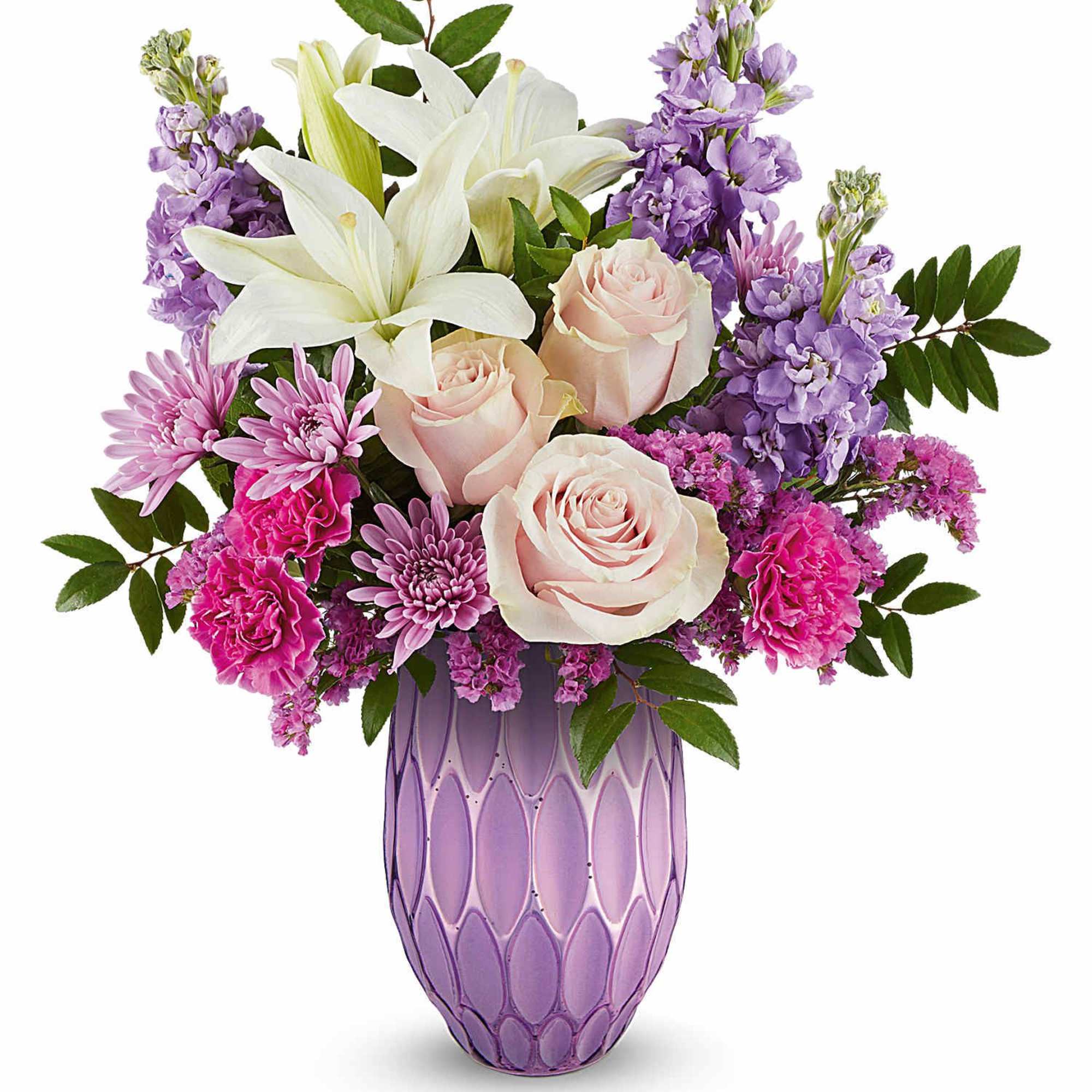 Pink roses and purple flowers arranged in a lavender vase