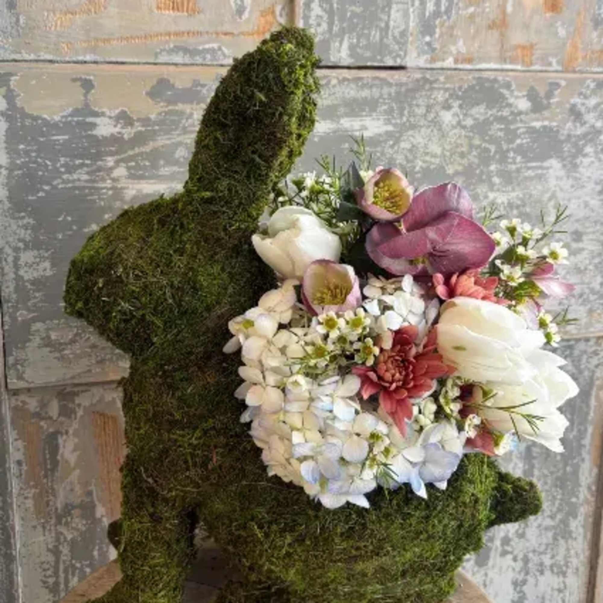 This sweet moss bunny is filled with fresh spring blooms and would