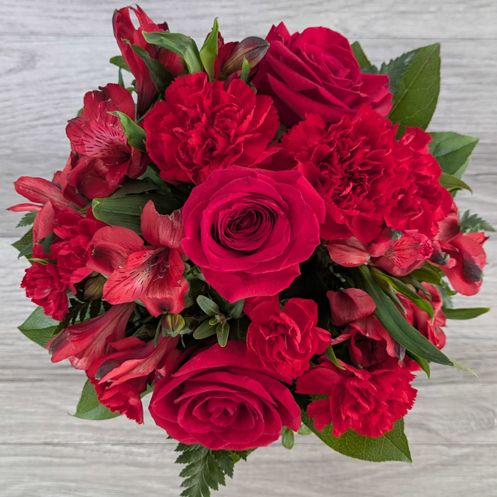 Ruby Slipper is A Ladybug Floral exclusive bouquet. This bouquet includes roses