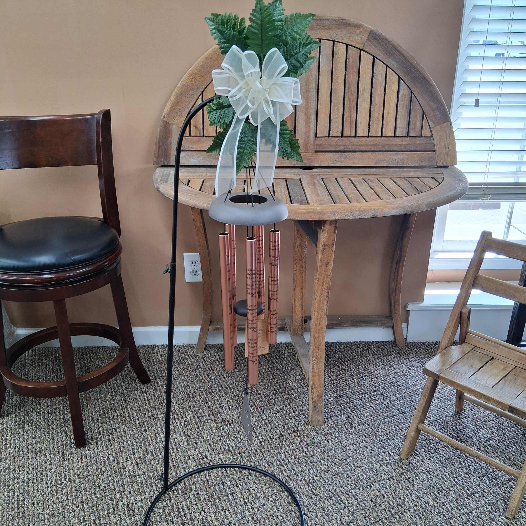 A rose-gold memorial wind chime that reads like a quiet tribute -