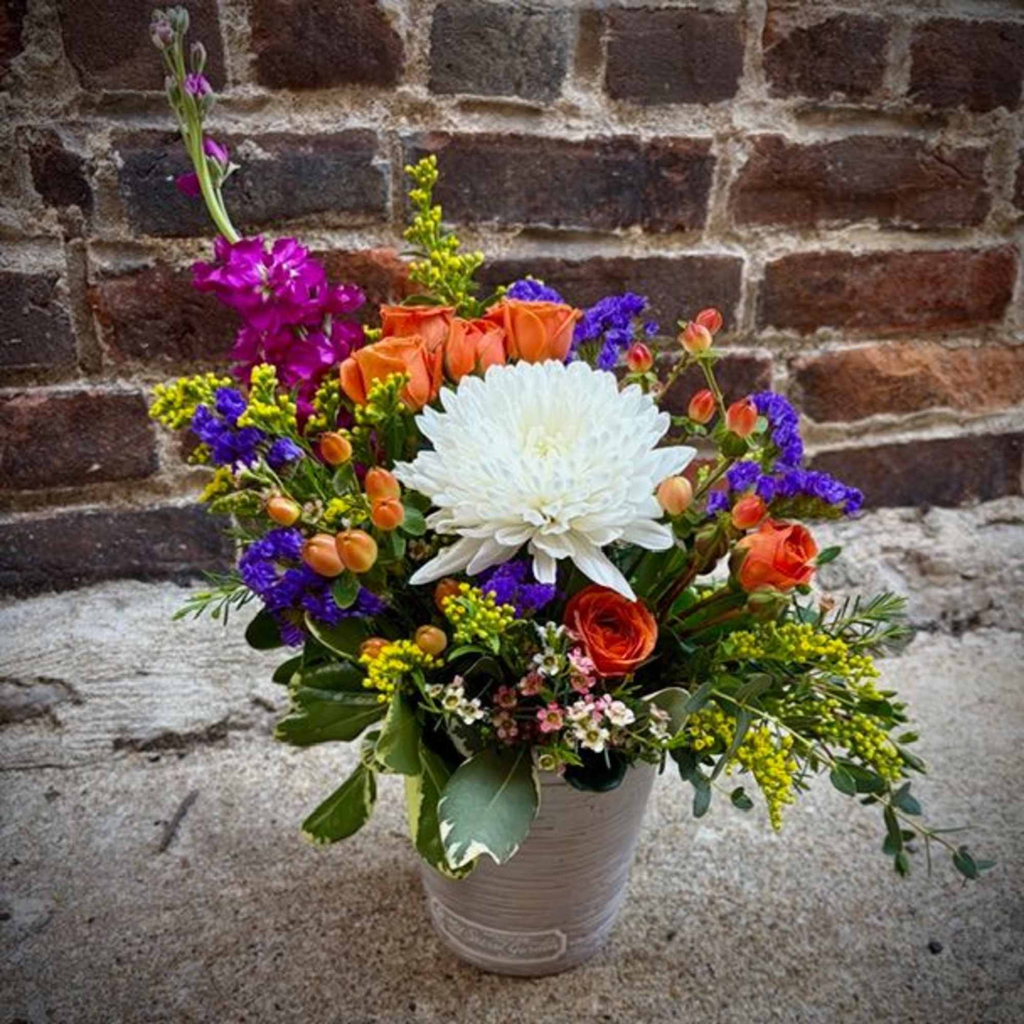 "Brilliant Blossoms" is a beautiful and petite floral design of vibrant flowers