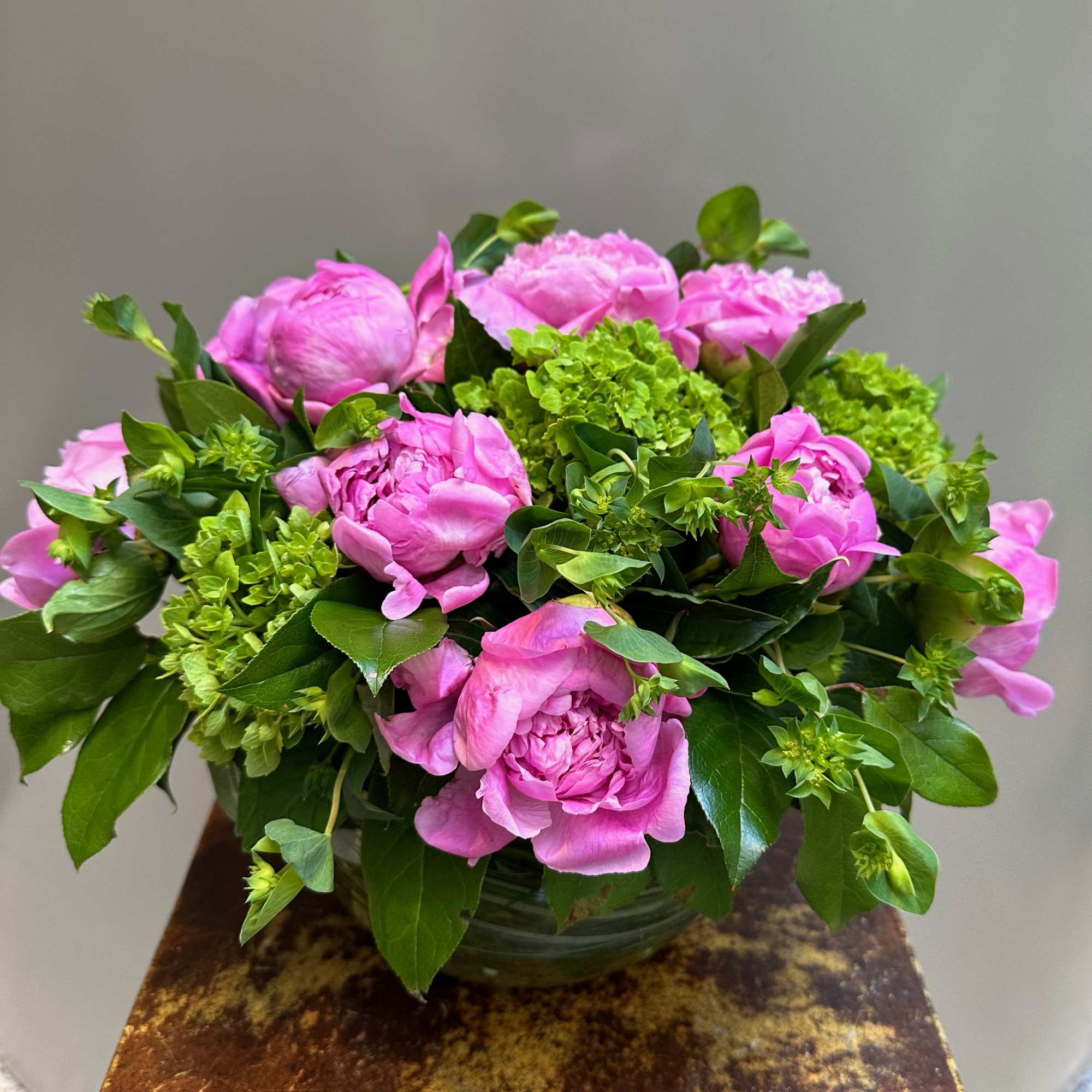 This arrangement is presented in a 8" clear glass bowl. It includes