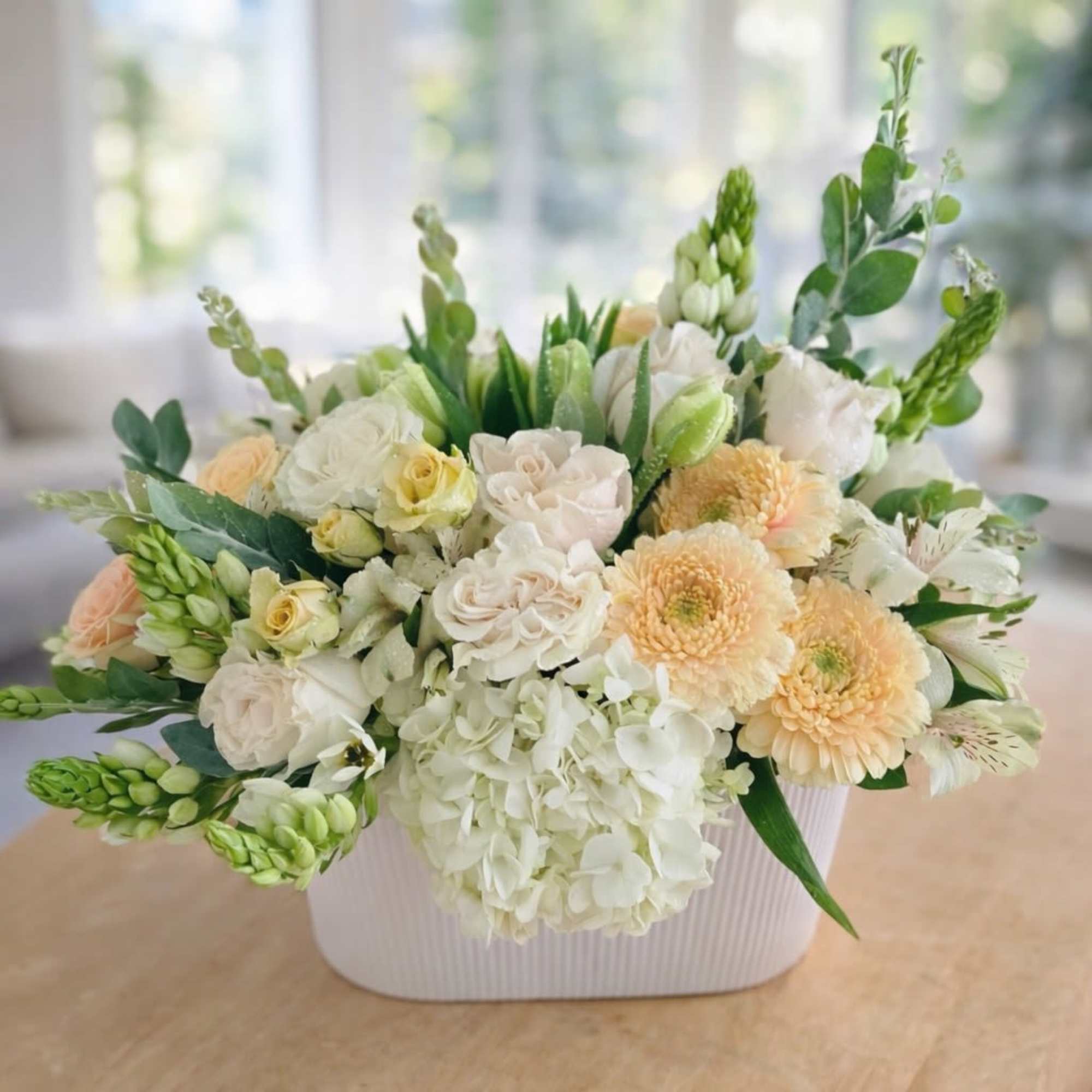 Sunday Morning is a soft, garden-inspired arrangement designed to bring a sense