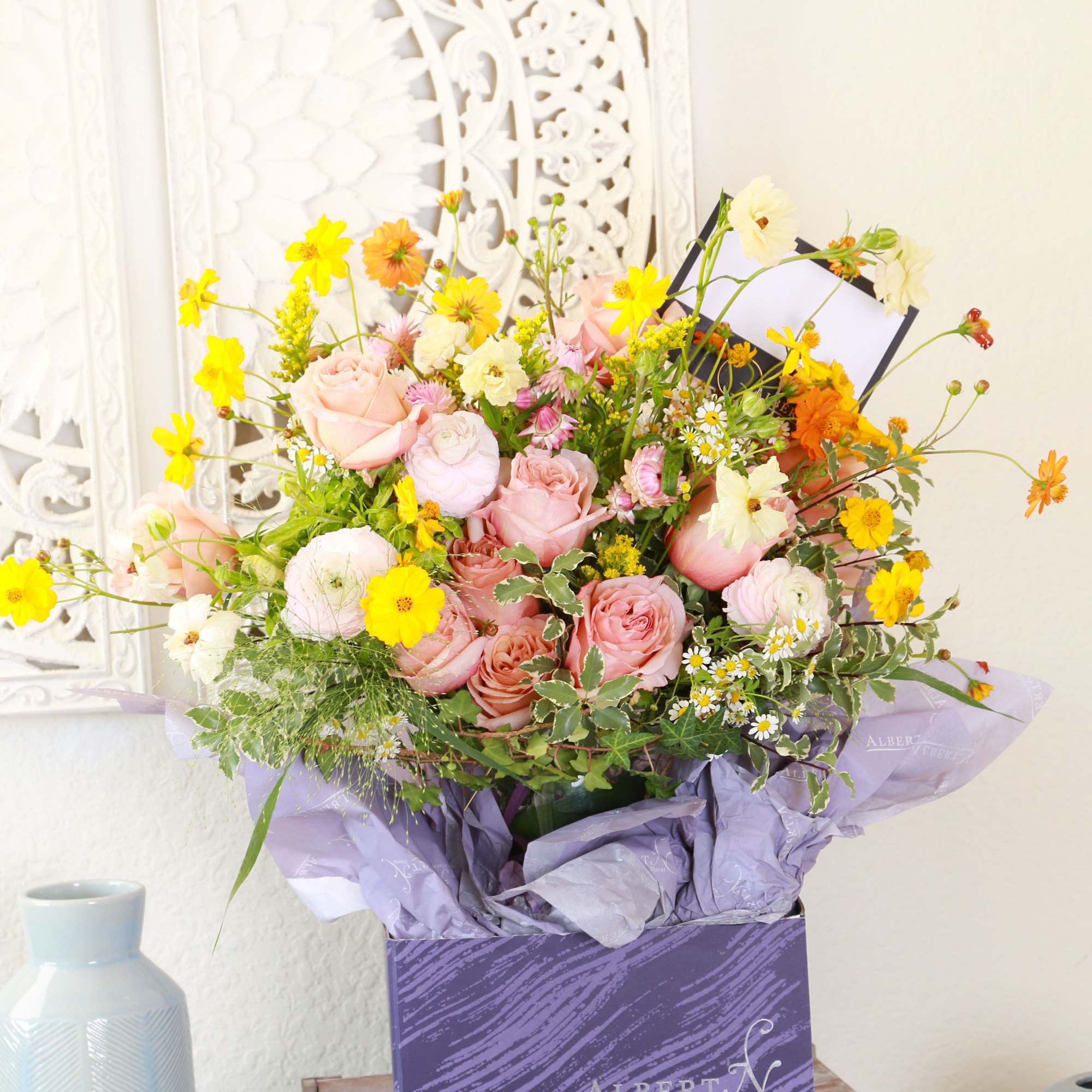 This exquisite bouquet features delicate coral peachy garden rose, ranunculus, hydrangea with