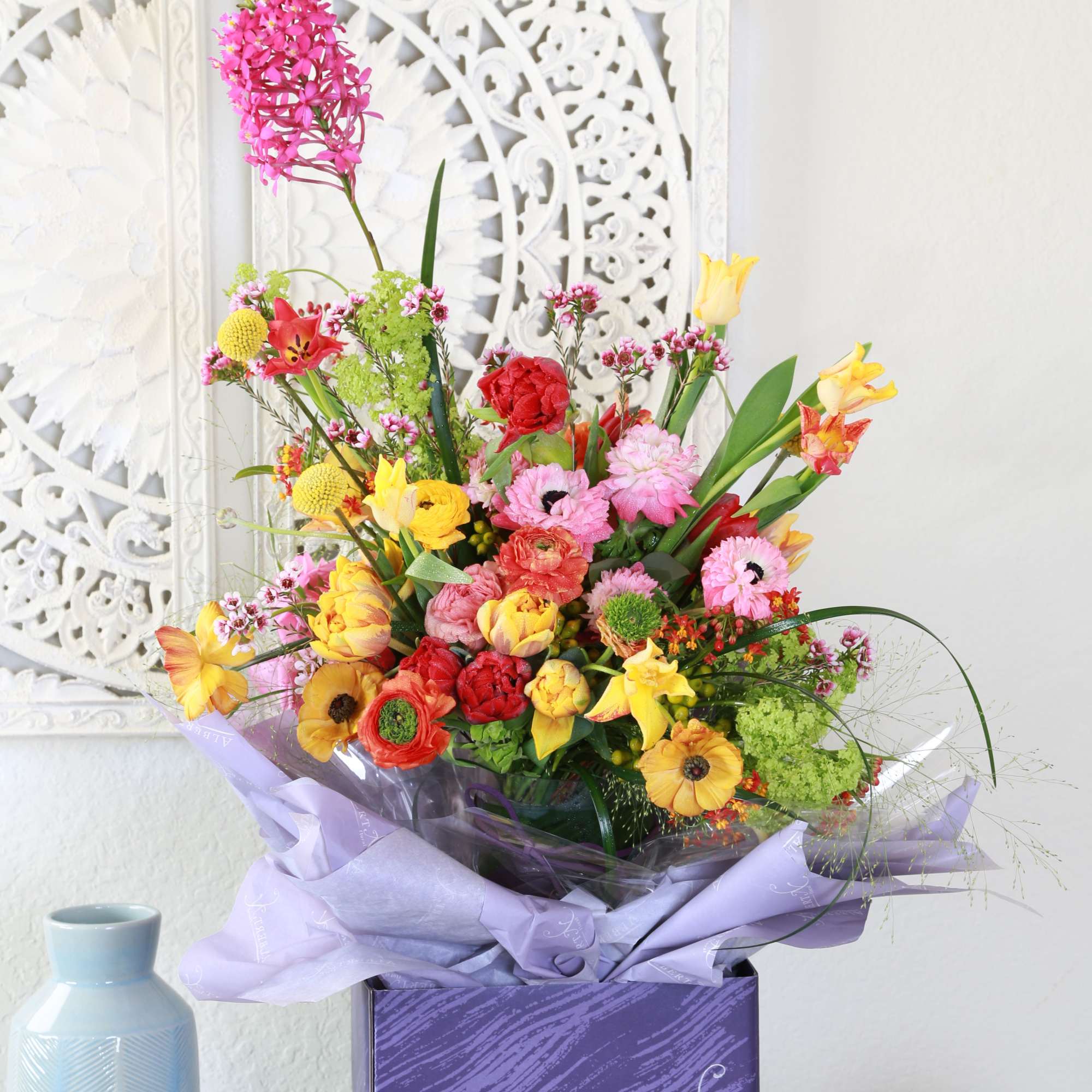 Brighten any room with our signature Spring Bloom arrangement- A vibrant celebration