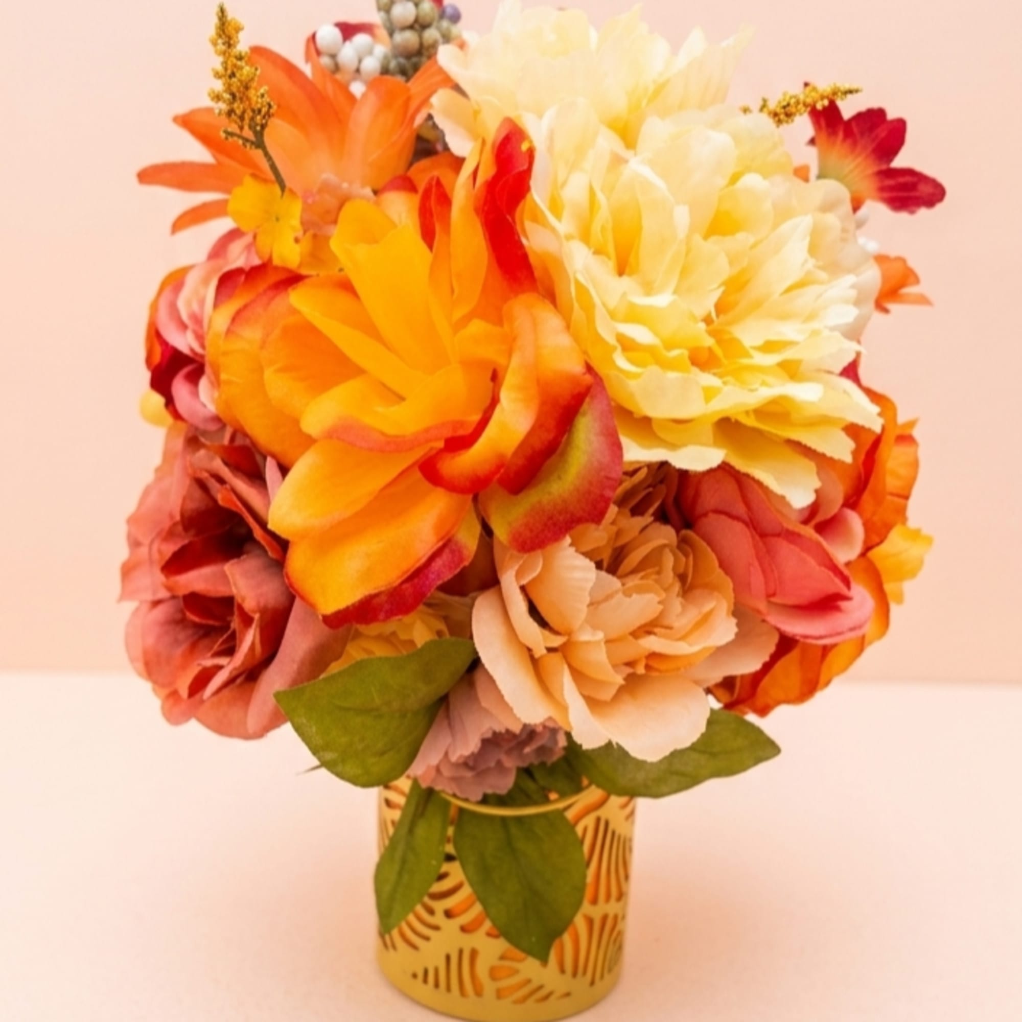 Sun-drenched citrus slices mingle with vibrant marigolds and yellow roses to create