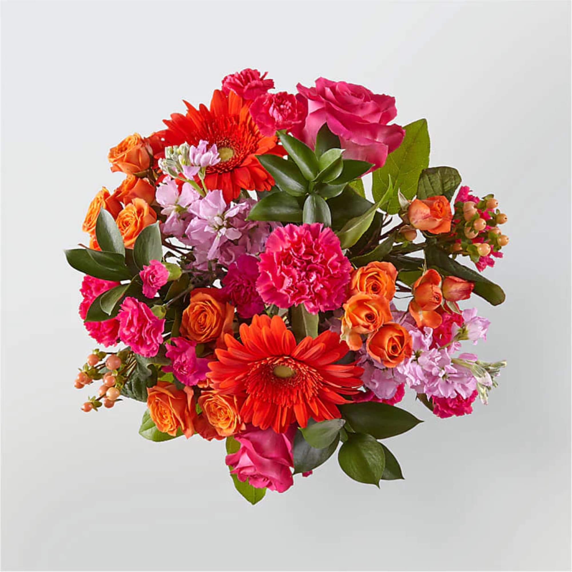 Bright bouquet of hot pink and orange roses, gerbera daisies, carnations, and mixed blooms