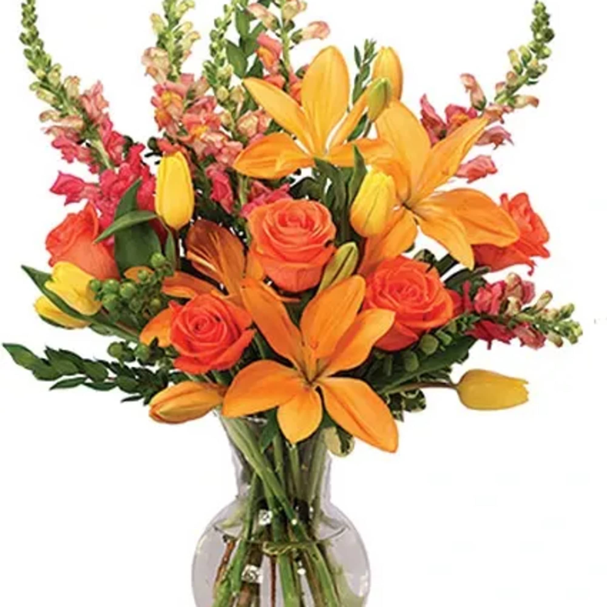Brighten their day with orange lilies, coral roses, and yellow tulips paired
