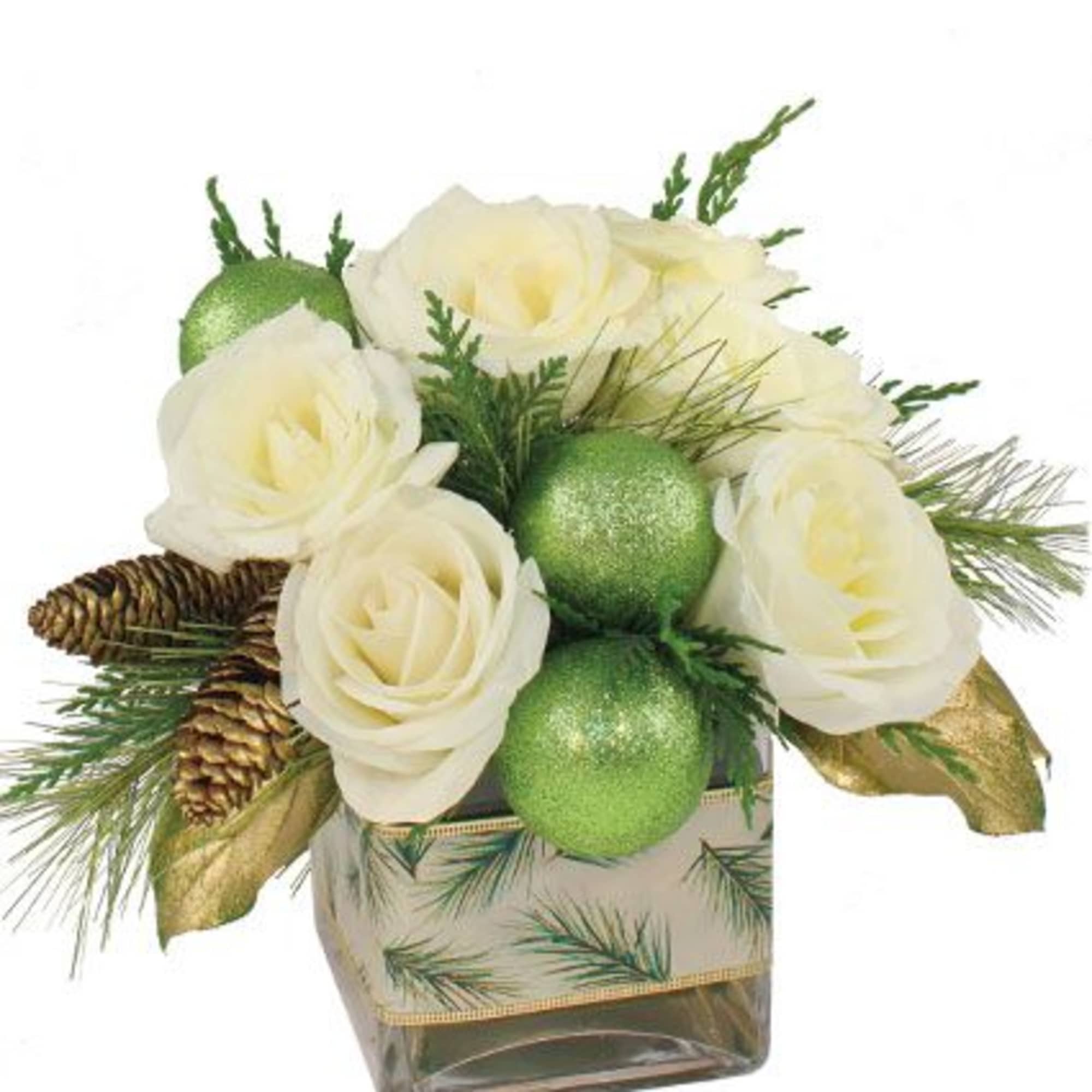 White roses, evergreens, festive pinecones and glittery green balls form a wintry