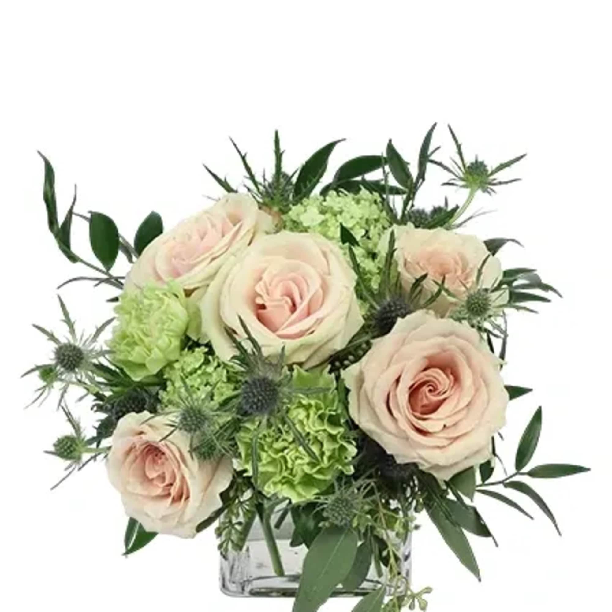 Green carnations, pale pink roses, blue thistles, and more

Includes:
Cube Vase, Seeded Eucalyptus