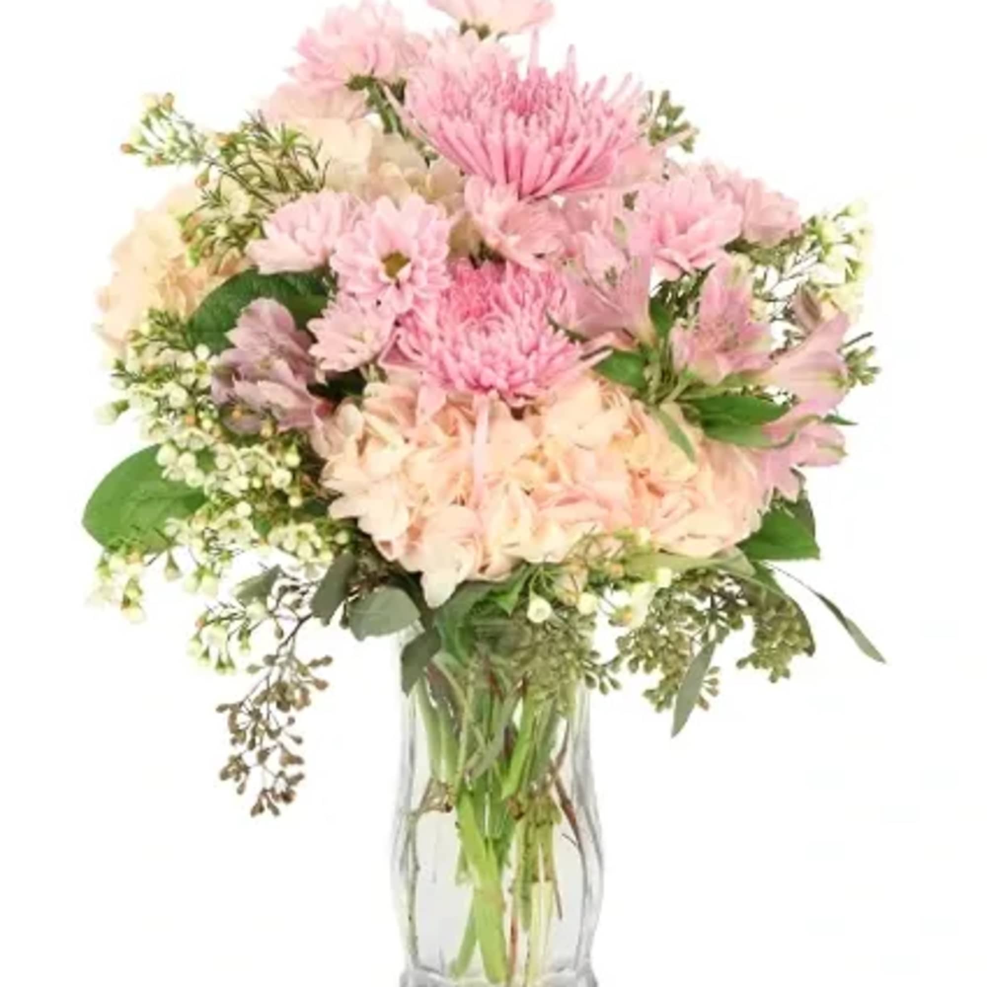 Delicate and charming, this arrangement features soft pink hydrangeas, lavender daisy poms