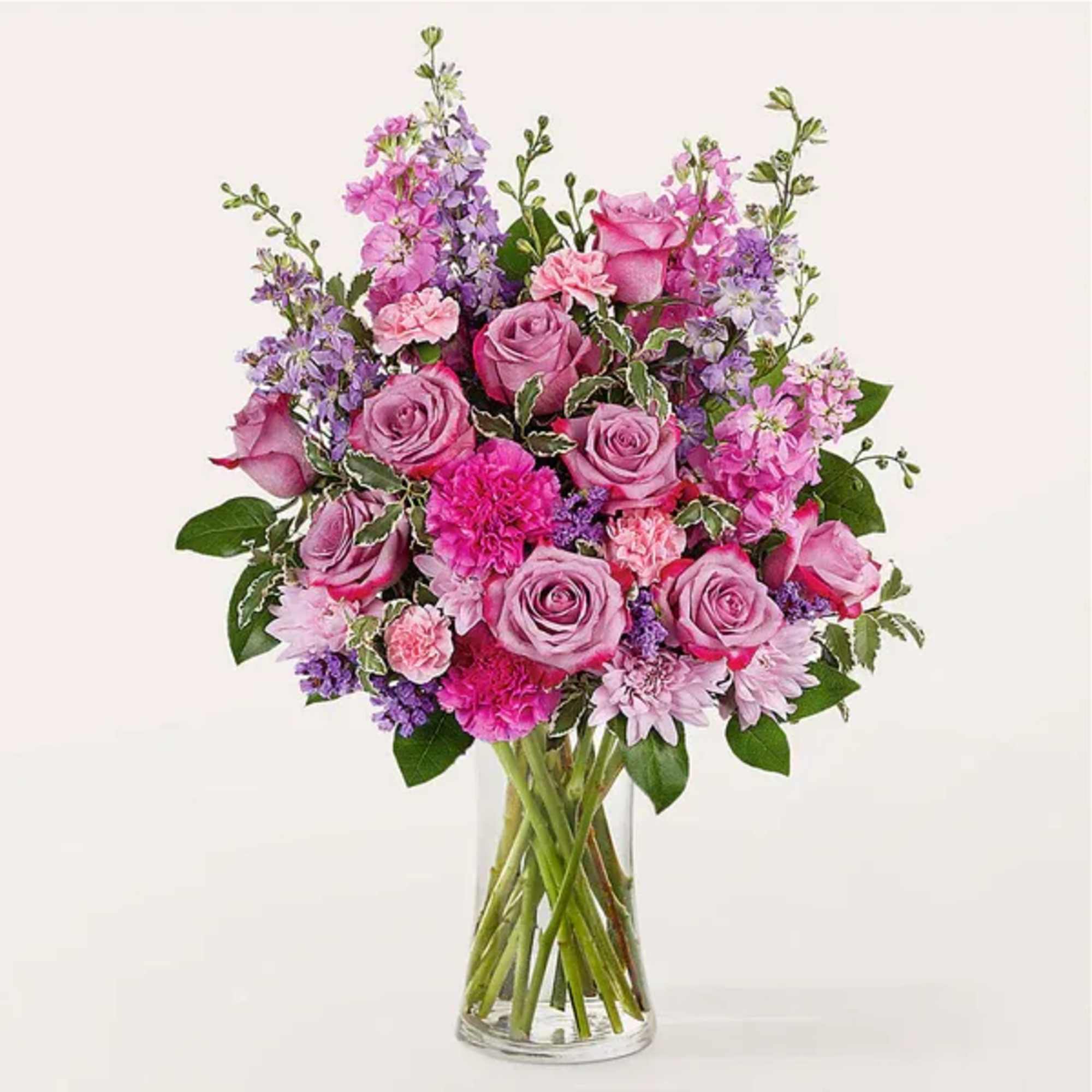 Pink and lavender mixed bouquet in a clear glass vase