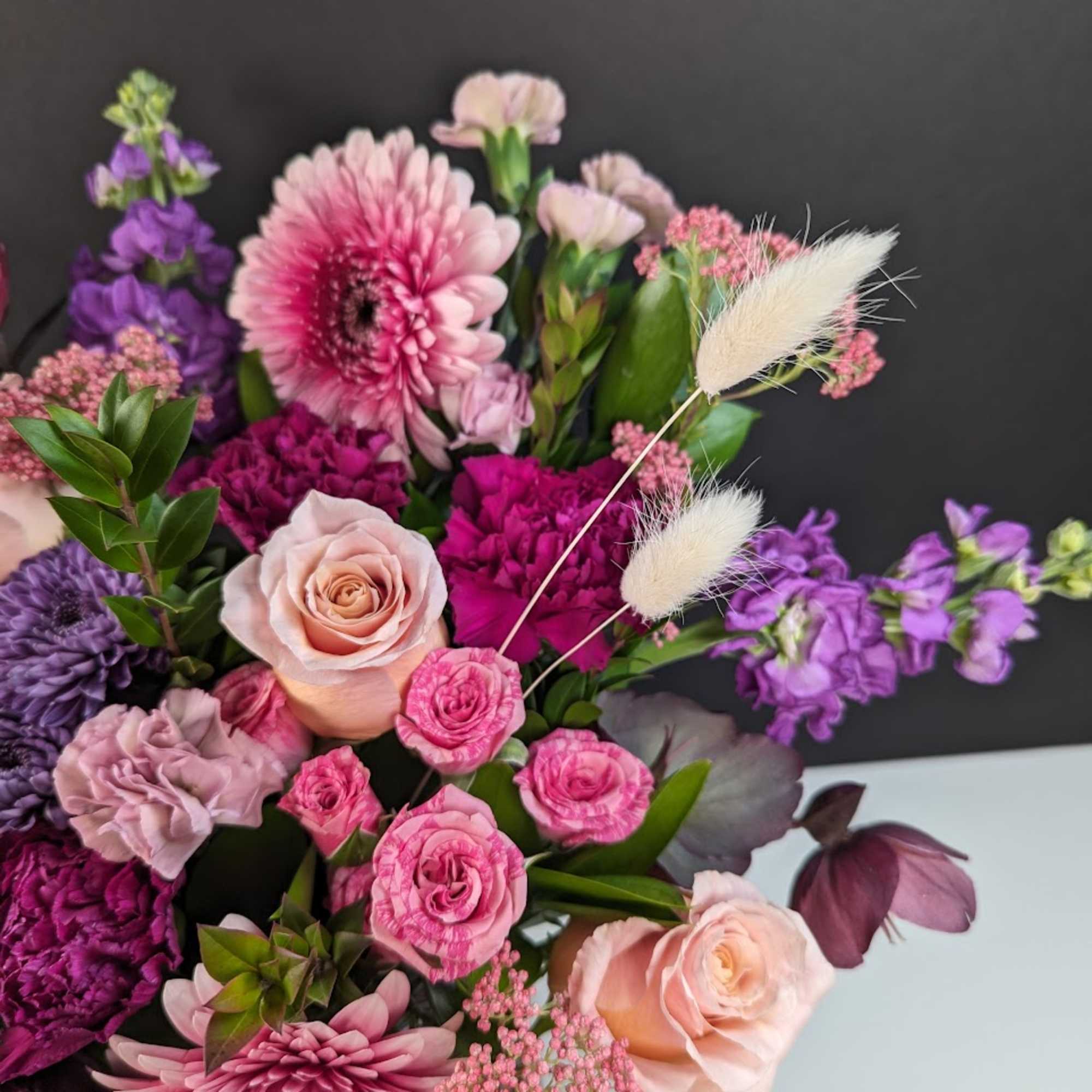 Pink and purple mixed bouquet with roses and gerbera daisies