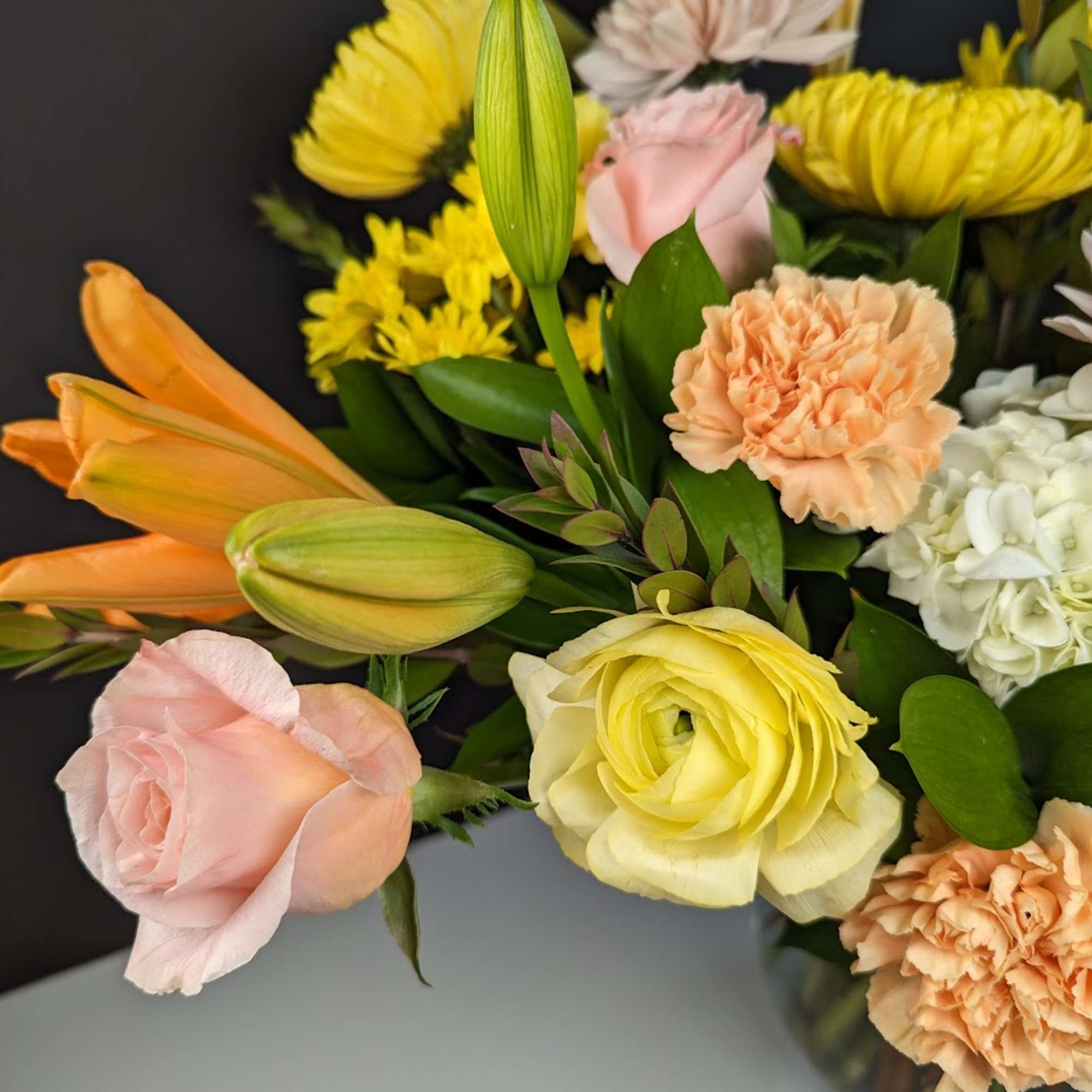 Mixed bouquet with roses, lilies, carnations, and chrysanthemums