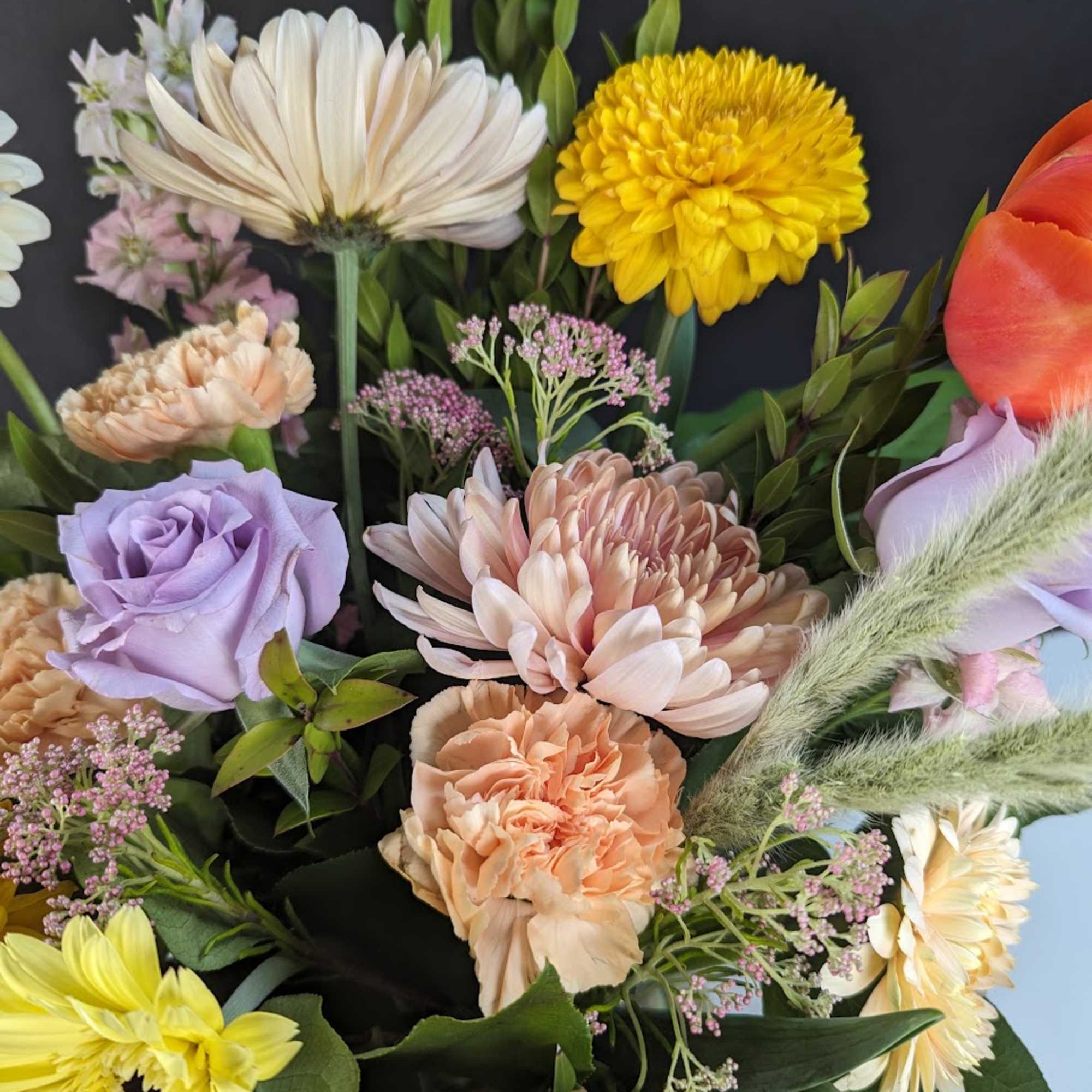Mixed bouquet with pastel roses, chrysanthemums, and daisies