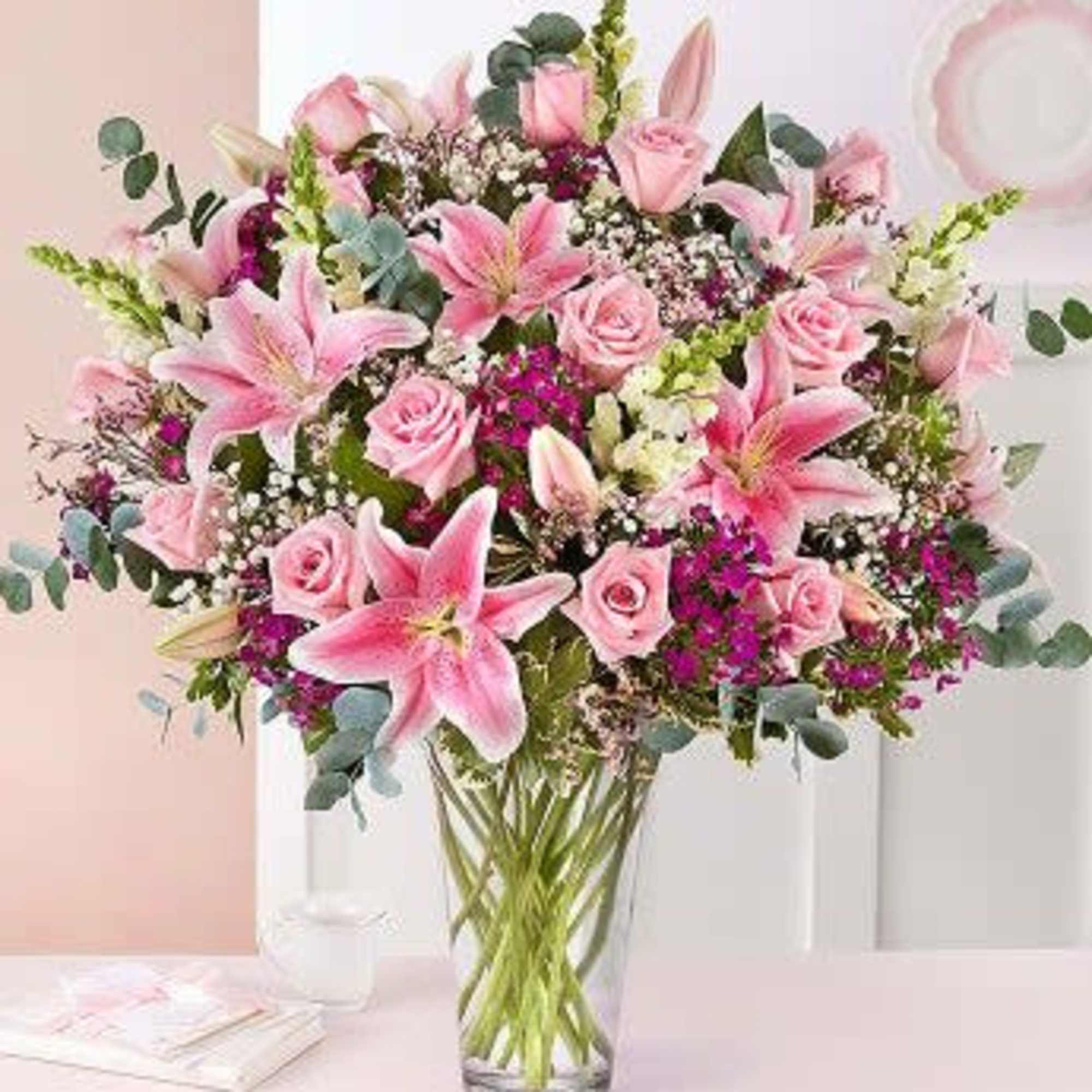 This Beautiful arrangement make with stargaze lily , roses, snapdragon , sweet