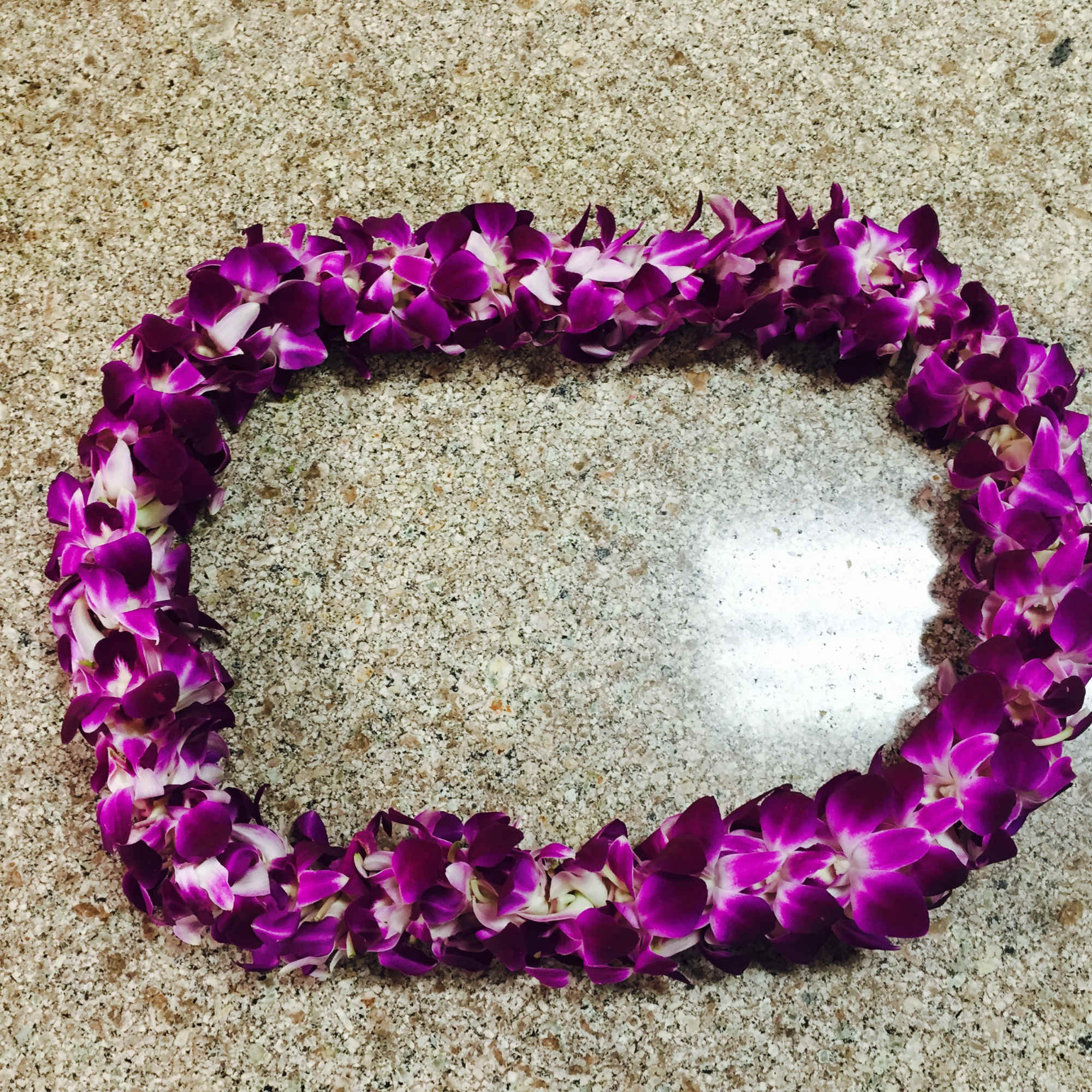 The orchid lei made with purple dendrobium orchids, you can choice with