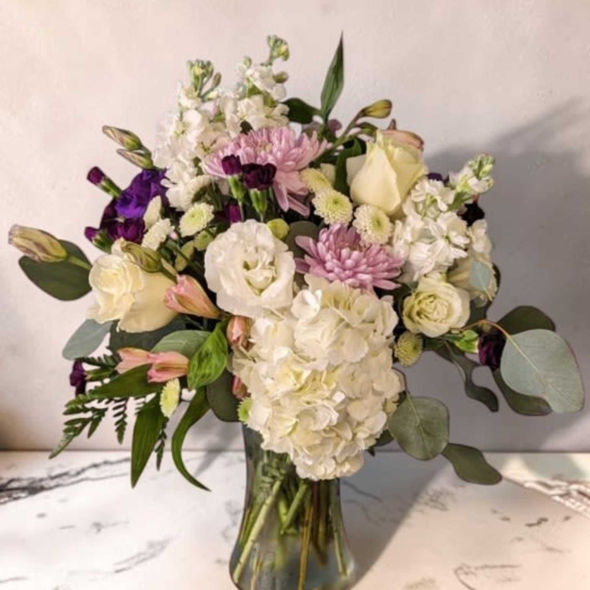 This soft and pretty arrangement is just right to show someone you're