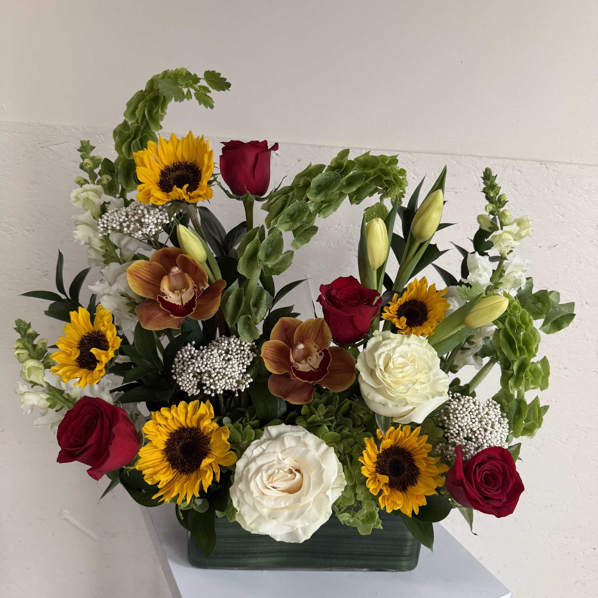 Creamy roses, soft hues, and golden touches for lasting love.