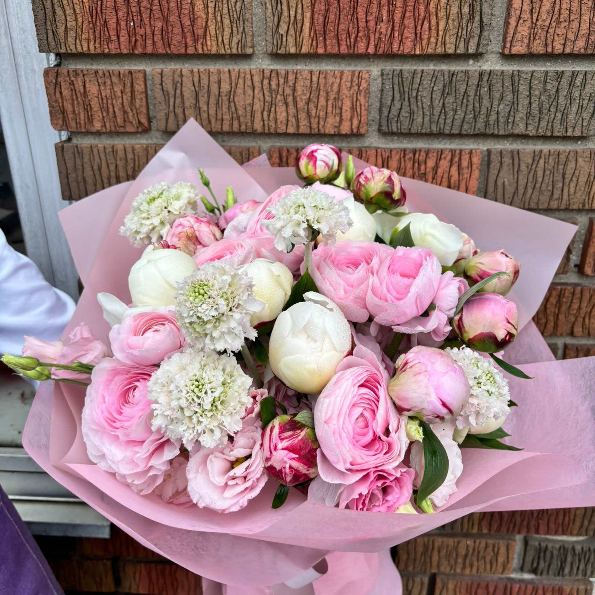 A luxurious, textured bouquet featuring soft pinks and creamy whites. This garden-style