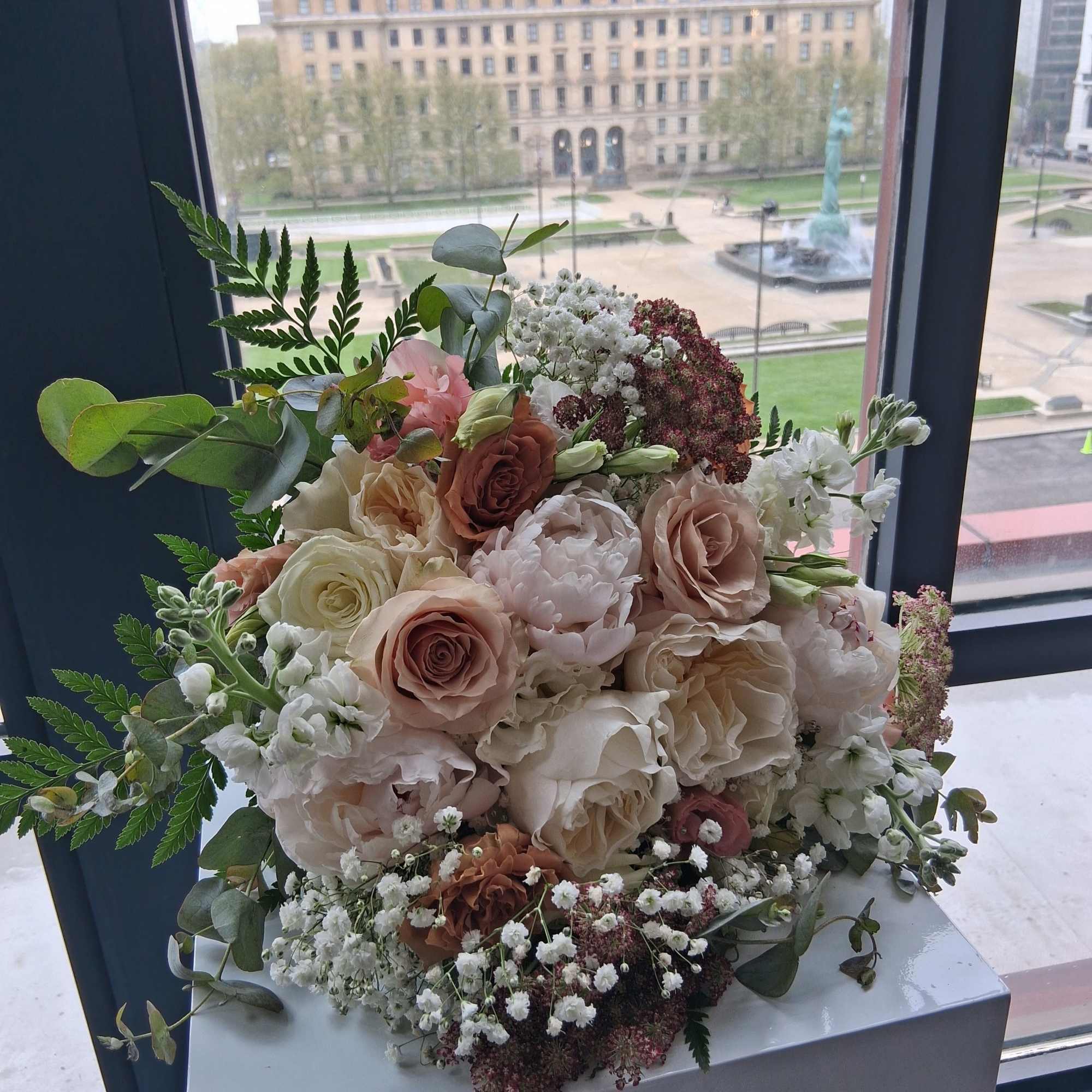 Beautiful intelligent mix of white, quick send and toffee color roses, peonies