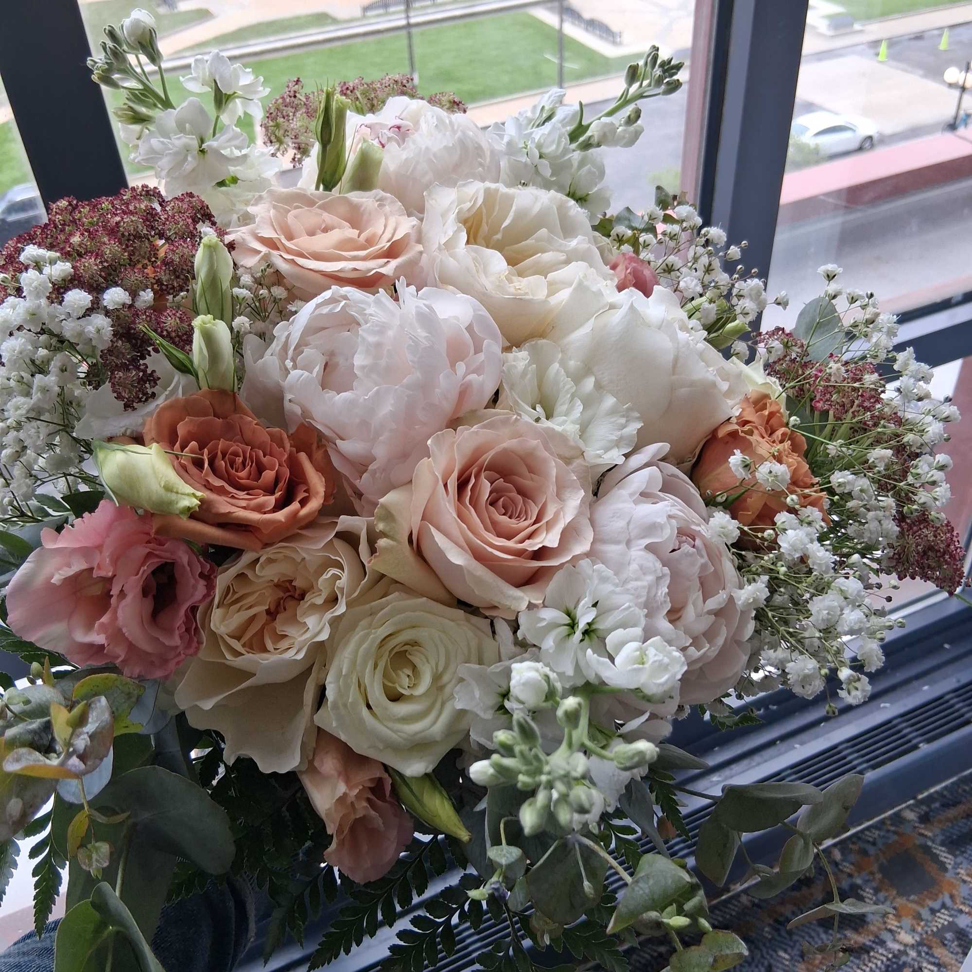 Beautiful intelligent mix of white, quick send and toffee color roses, peonies