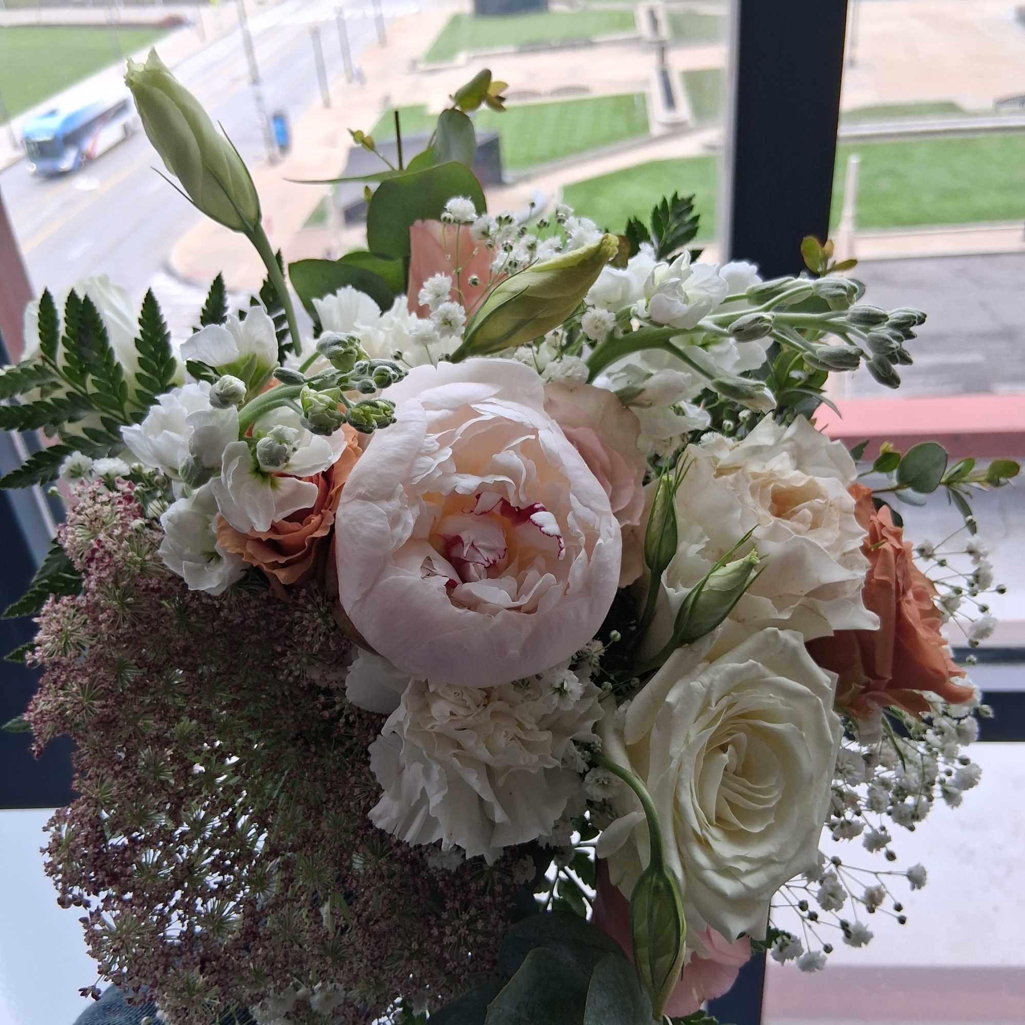 Beautiful intelligent mix of white, quick send and toffee color roses, peonies