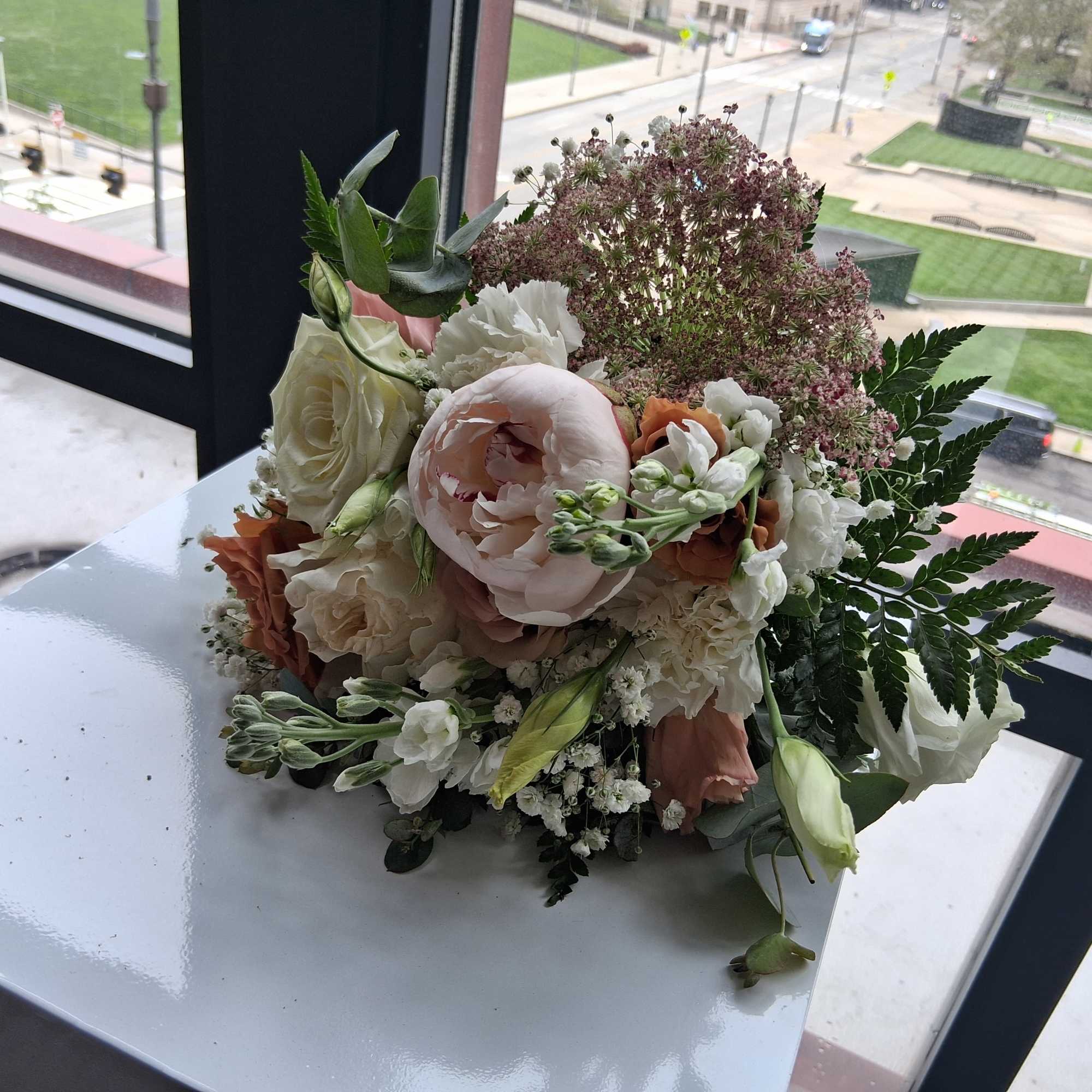 Beautiful intelligent mix of white, quick send and toffee color roses, peonies