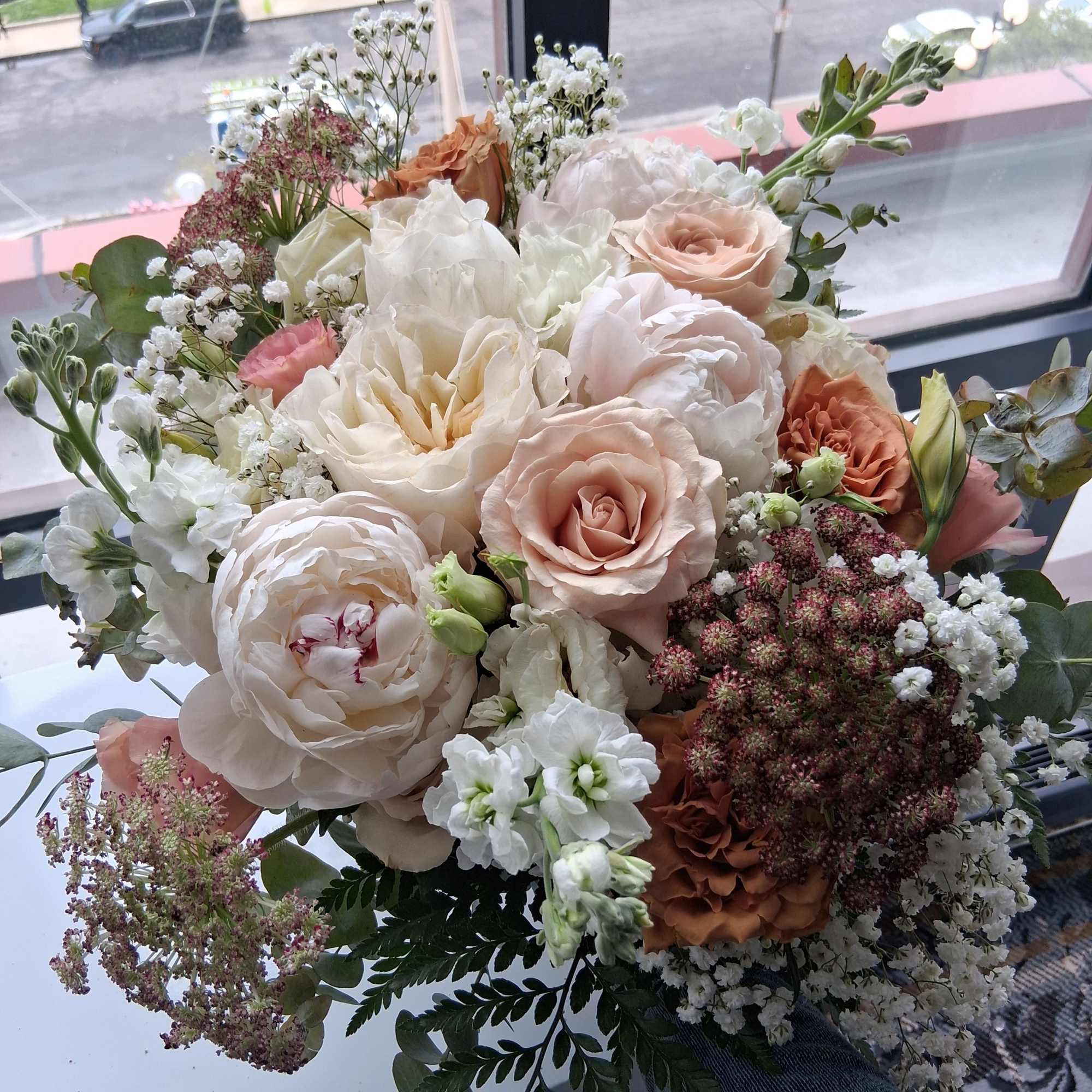 Beautiful intelligent mix of white, quick send and toffee color roses, peonies