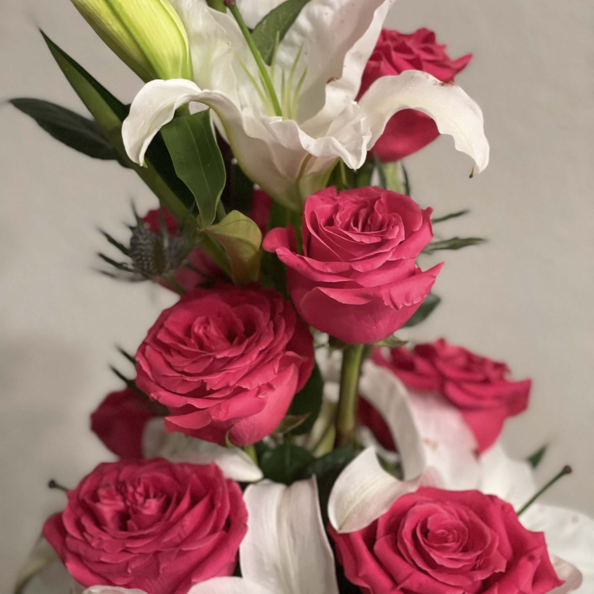 Bouquet of hot pink roses and white lilies