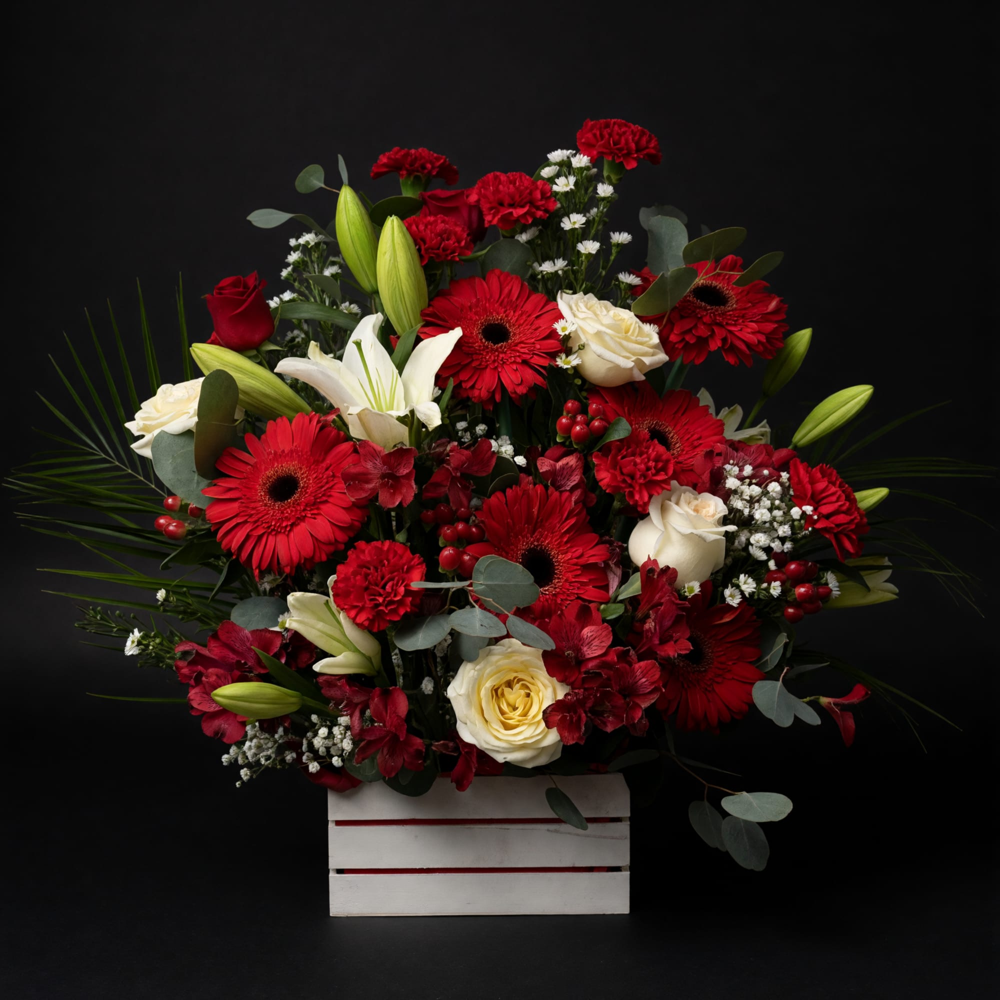 A bold red-and-white crate arrangement that reads as both festive and deeply