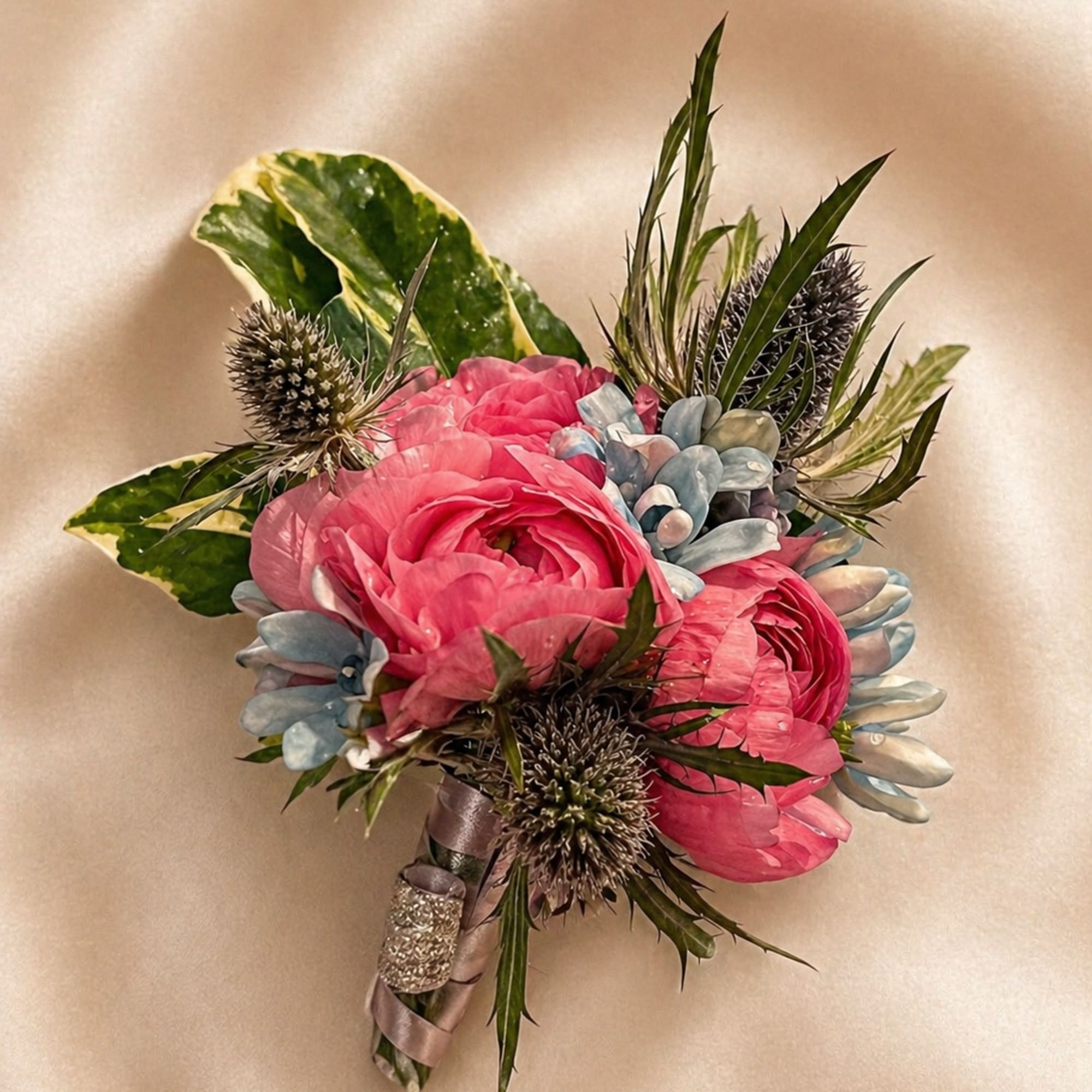 A custom-designed wrist corsage created to complement your chosen color palette. Whether