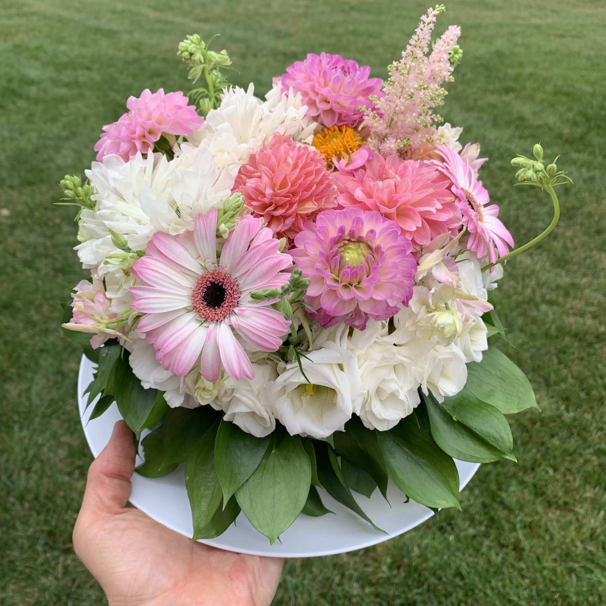 Pink and white mixed bouquet on a white plate