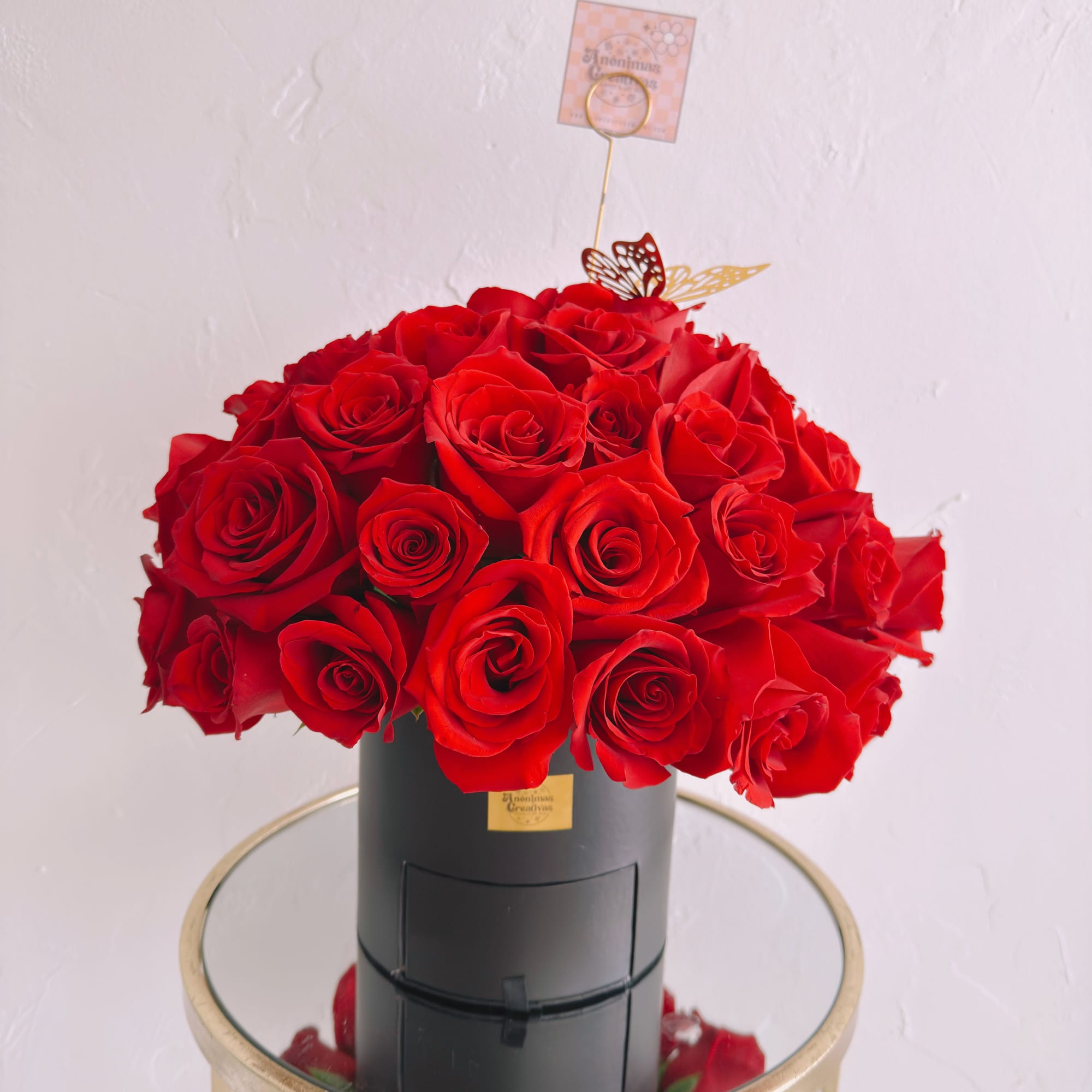 An elegant and captivating arrangement featuring 50 premium red roses, beautifully arranged