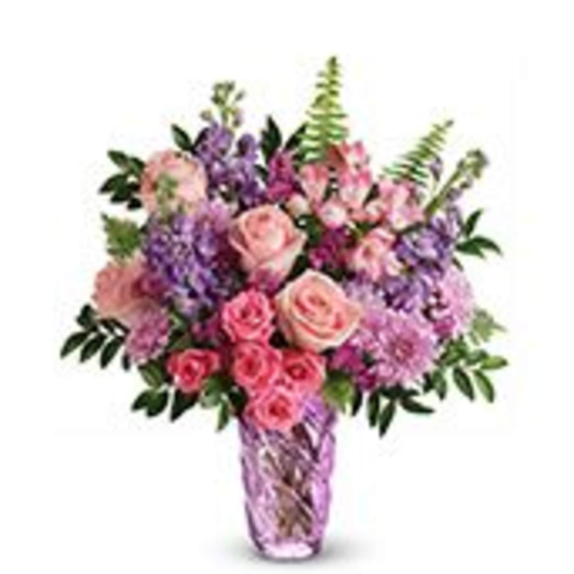 A lush spray of pink roses and lavender lilac creates the first