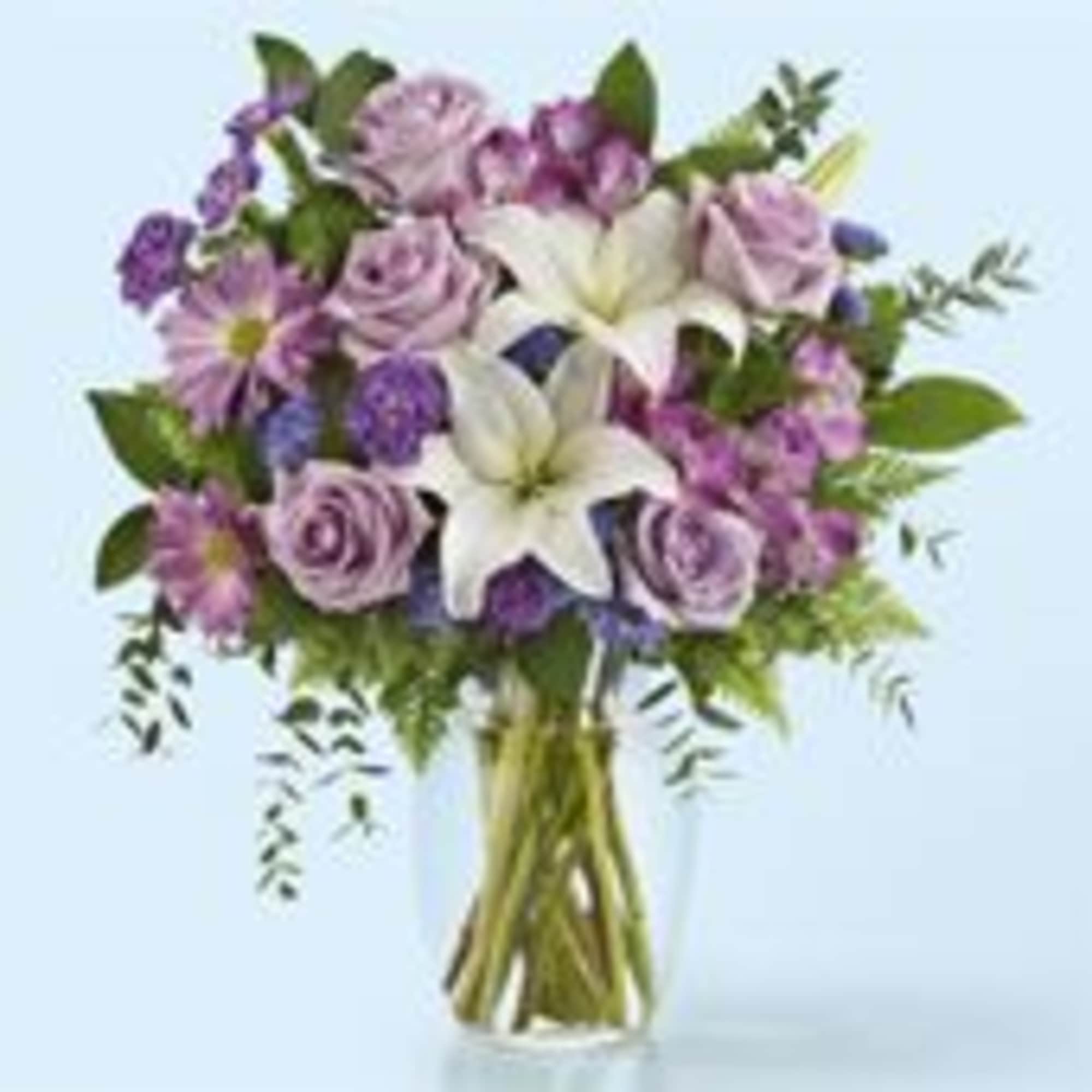 Soft lavender roses and airy daisy-like blooms tumble around two prominent white