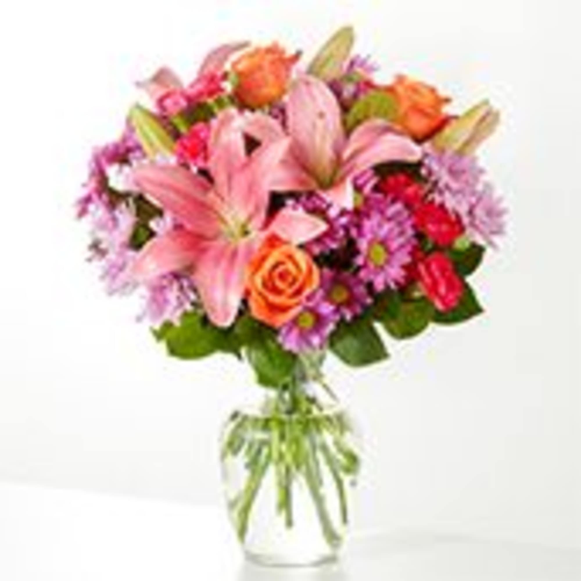 Big, blush-pink lilies take center stage in this full, rounded flower arrangement-paired