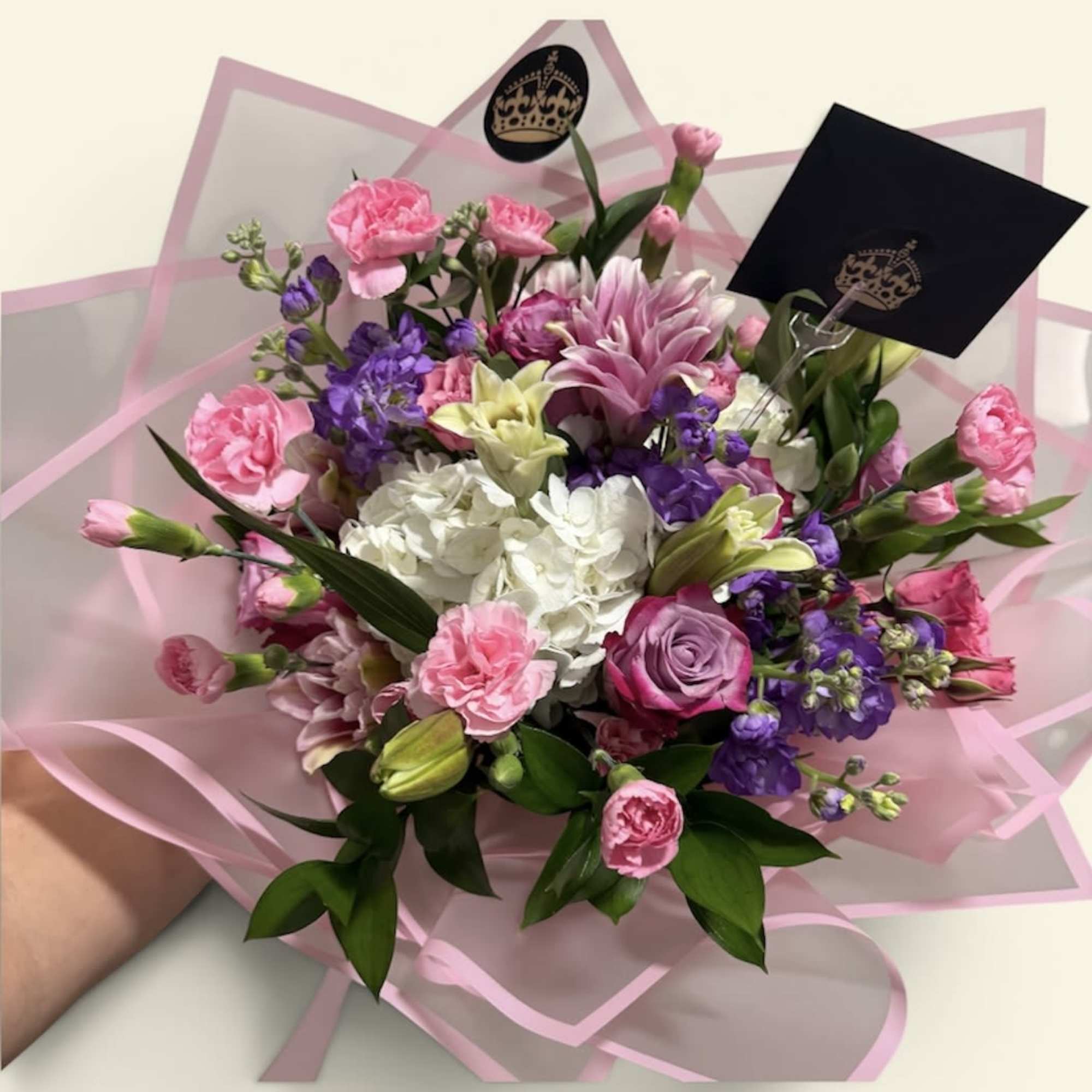 A beautifully handcrafted bouquet featuring a curated selection of fresh, mixed flowers.